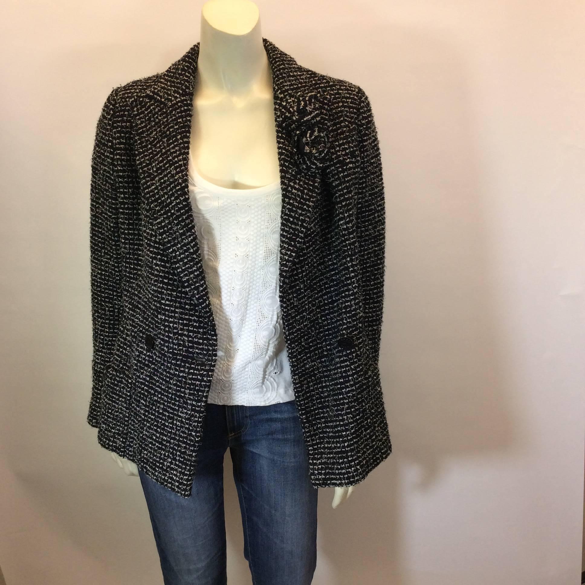 Black and White Sequined Tweed Jacket with Florettes
One button closure on jacket front
Two removable tweed florettes on collar 
3 button cuff
Size 38 (equates to US 6)
70% Wool, 30% Nylon with Silk and Spandex Lining