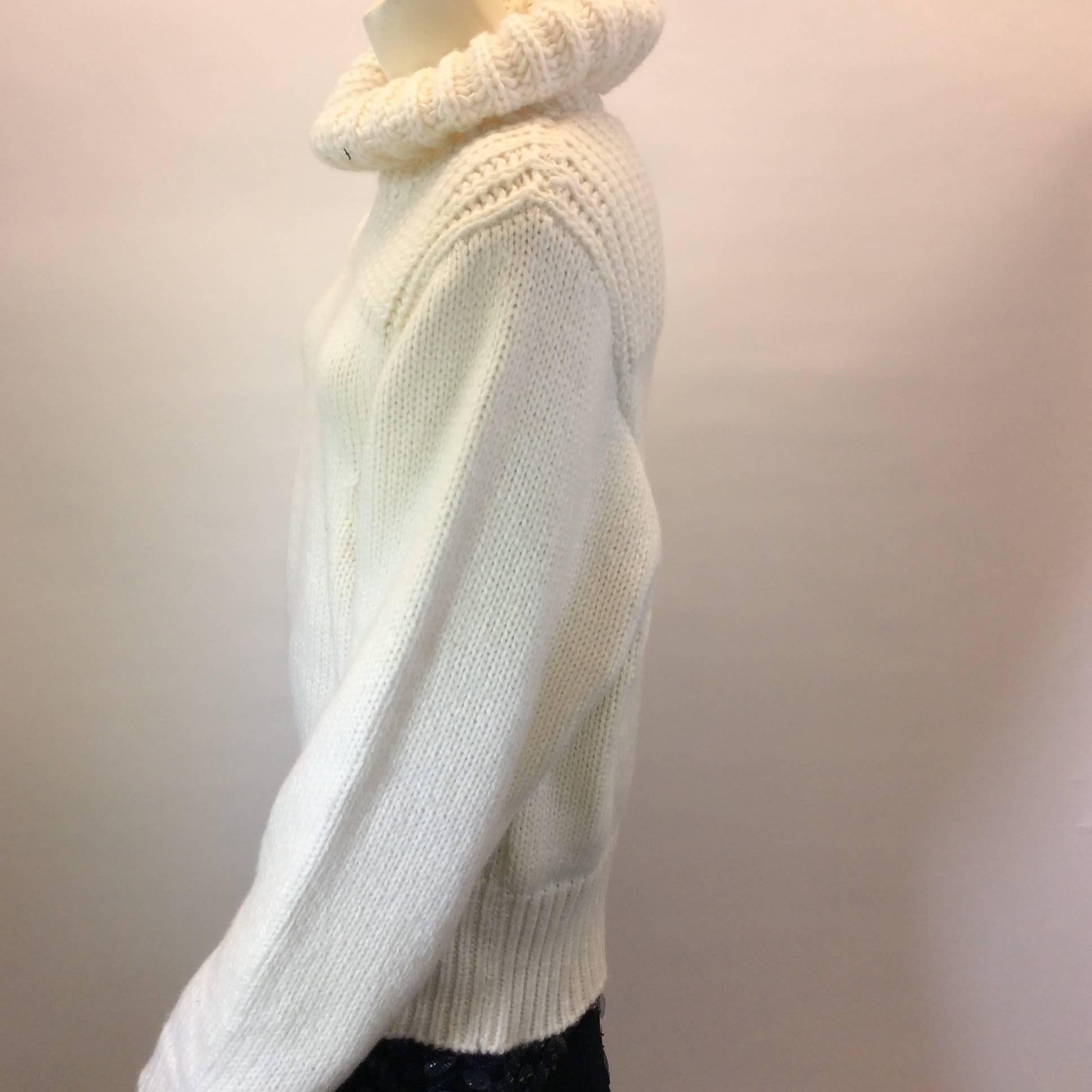 White Chunky Knit Sweater with High Neck
Features decorative ribbing around collar and shoulders
Size 40 (equates to US 10)
78% virgin wool, 22% Polyamide