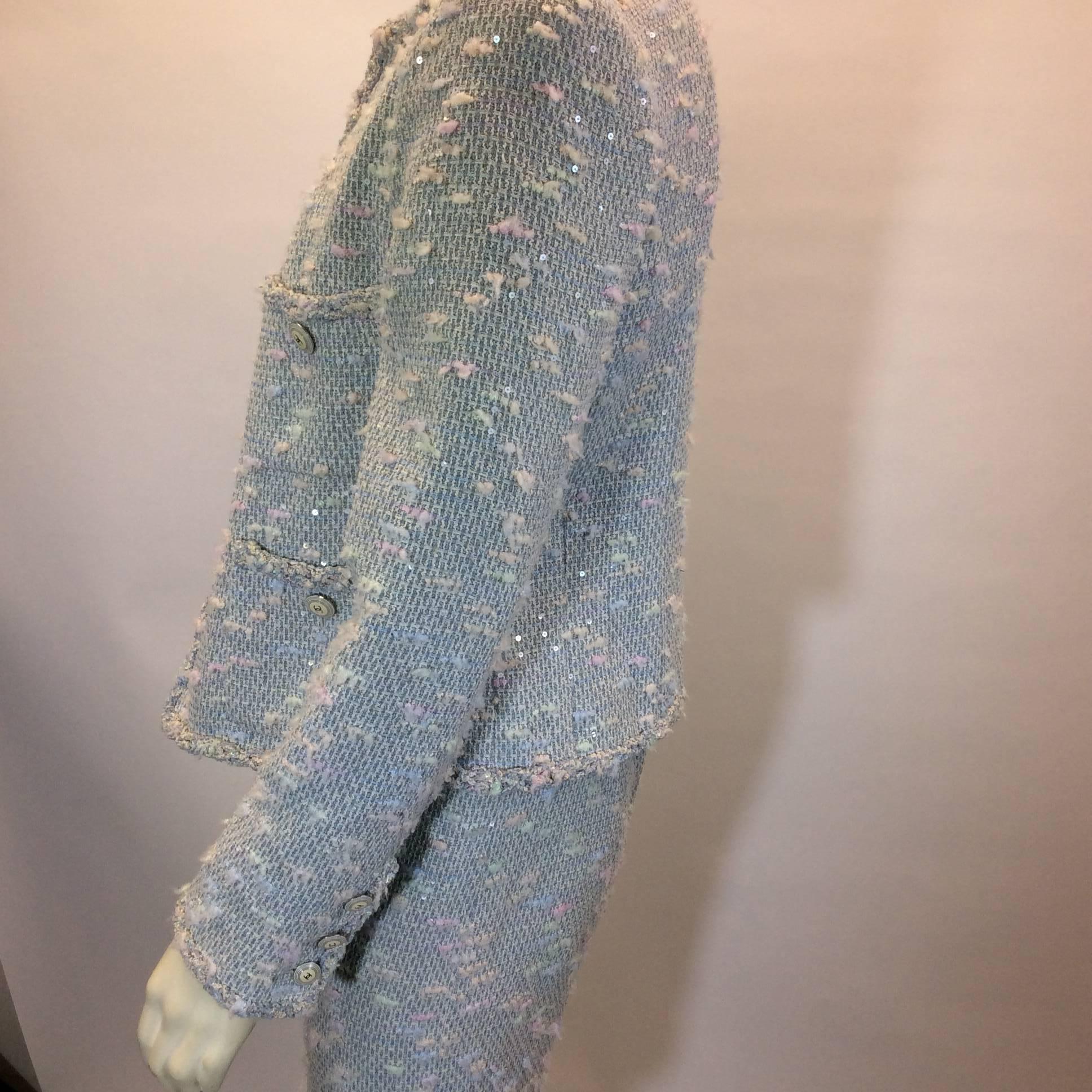 Blue Sequined Skirt Suit
Jacket includes two chest pockets and two hip pockets
Zipper closure on skirt center back
Size 38 (equates to US 8)
38% Nylon, 25% Cotton, 25% Wool, 12% Polyester
100% Silk lining