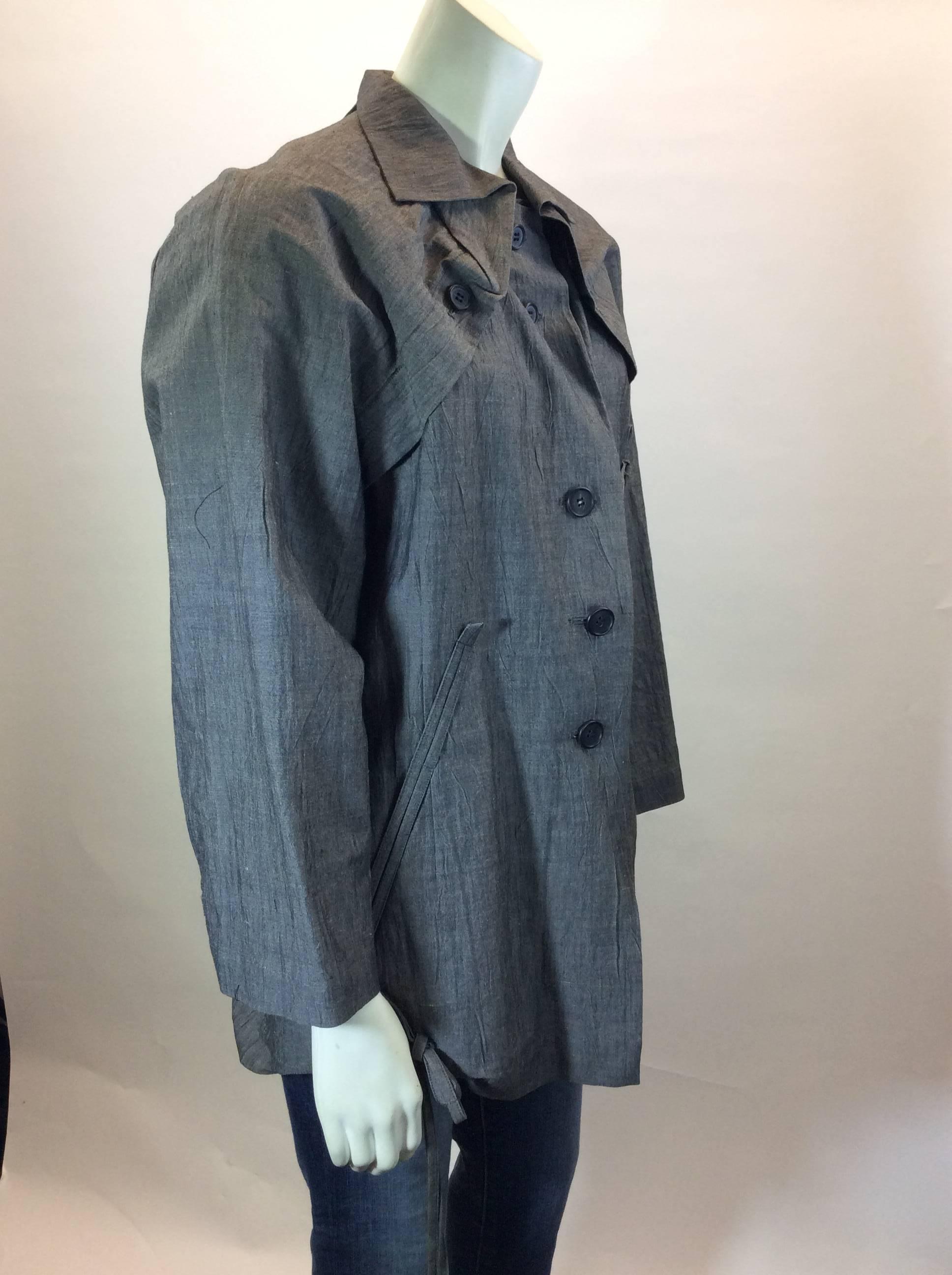 Grey Linen 
Buttons up front for Closure
Button Detail on Collar
Drawstrings on bottom of Coat
23