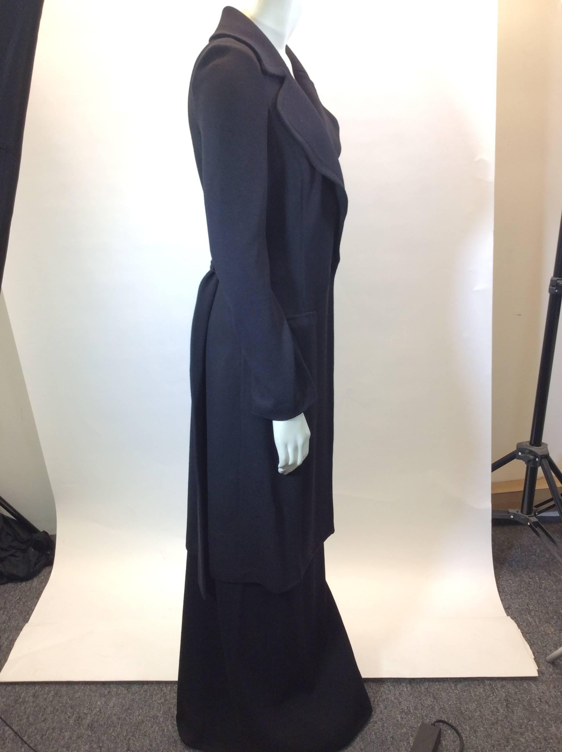 St John Black Skirt Set
Jacket is a long trench with belt and 2 deep pockets
Skirt is ankle length
Size 4 