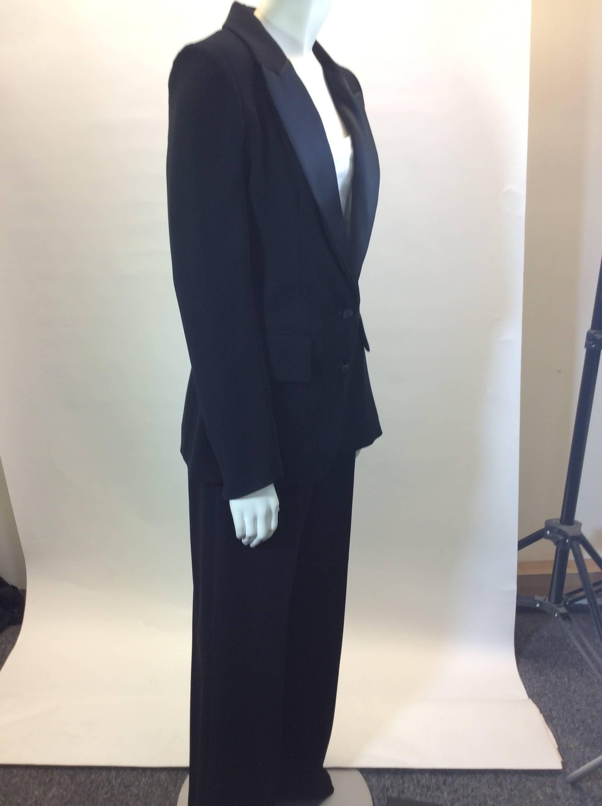 Yves Saint Laurent Pant Suit
Tuxedo style
Made in France
Blazer has 2 pockets and two center buttons
100% polyester 
Lined
Pants has three clasps and zipper