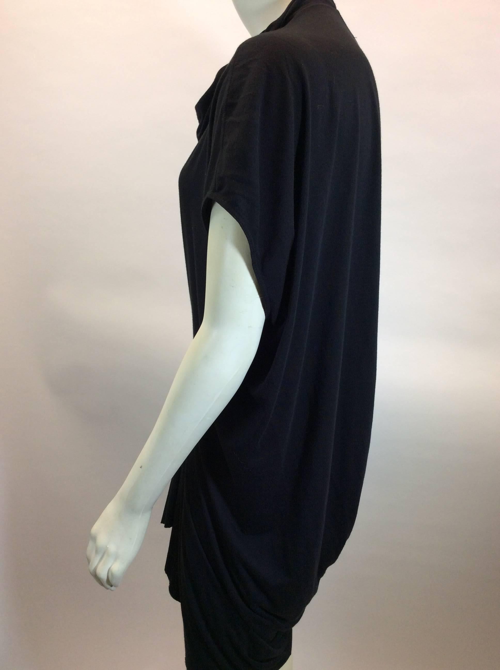 Black Center Seam Draped Dress
Features low armholes and cowl neck
High-low hemline
Size and fiber content unknown (see garment measurements)