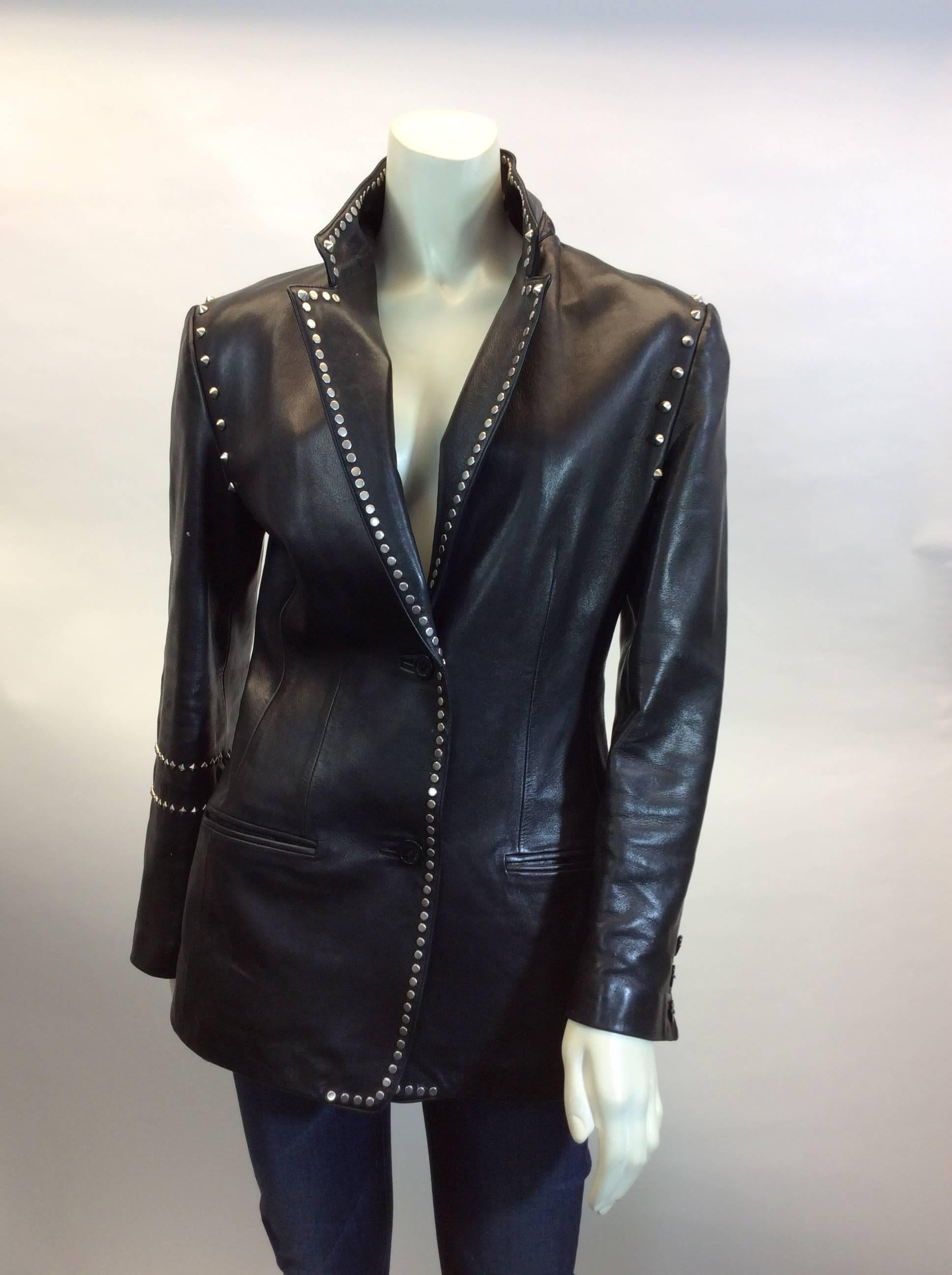 Gianni Versace Leather Jacket
Small and large studs
Two rows of studs on left arm
Made in Italy
Lined
All studs are in tact and in place except for the inner side of the first row of studs on the left arm. One is missing - noted in last photo
