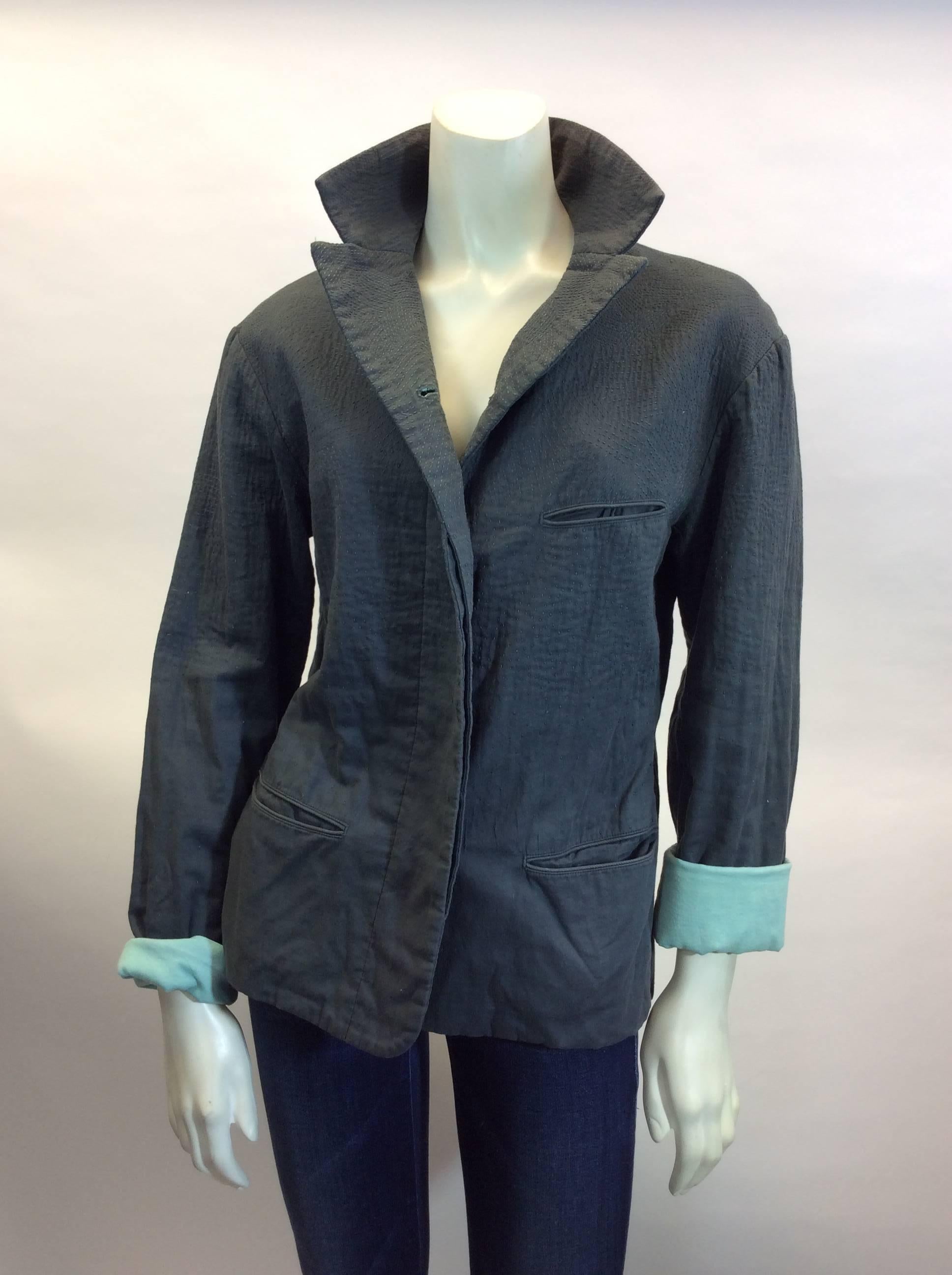 Issey Miyake
Grey exterior with grey stitch detailing
Interior lined with mint
Made in China
Size 3
100% Cotton