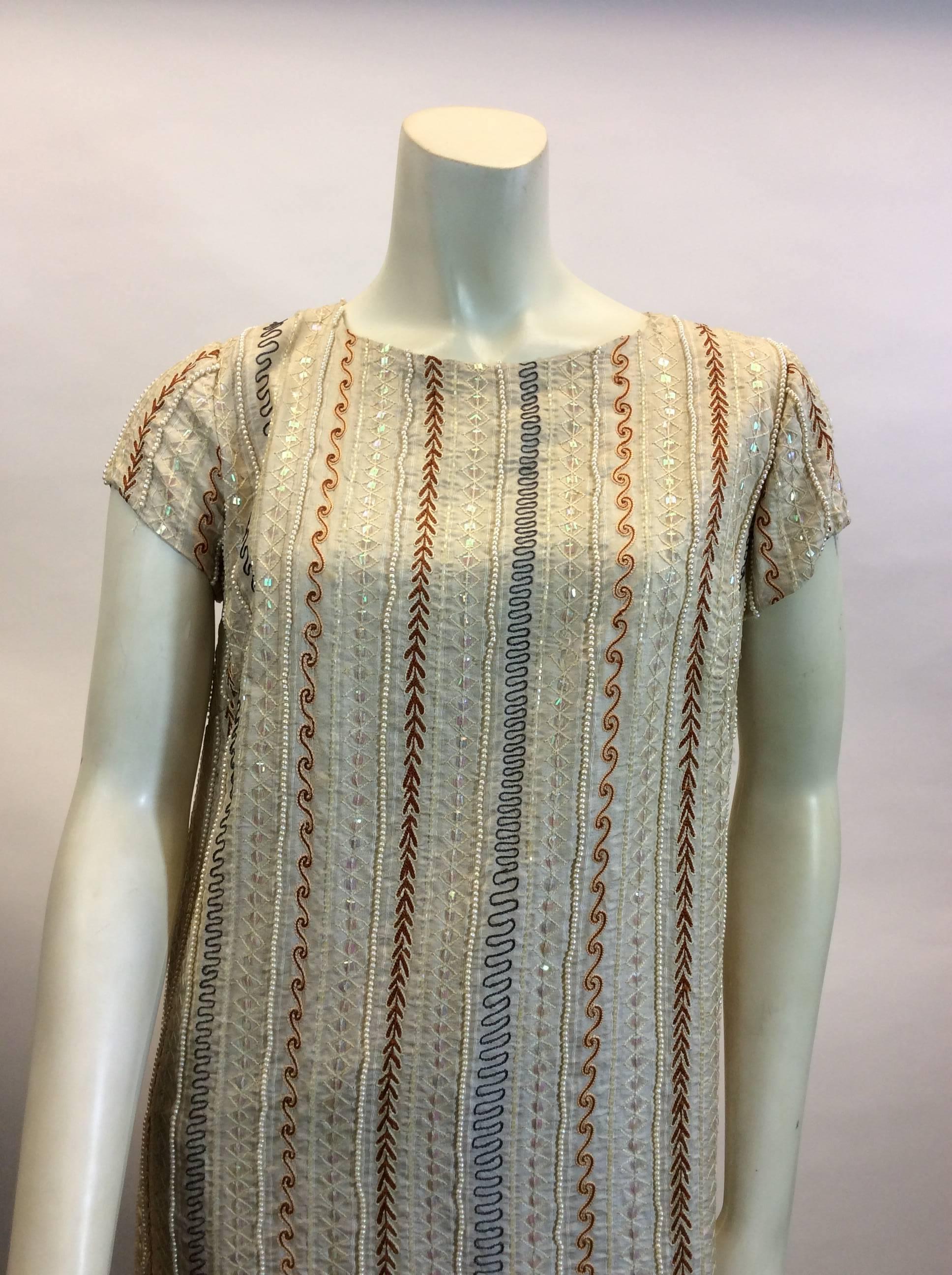 Vintage Beaded Tunic 
Couture Silva
Cream exterior and lined
A slit on either side of tunic
