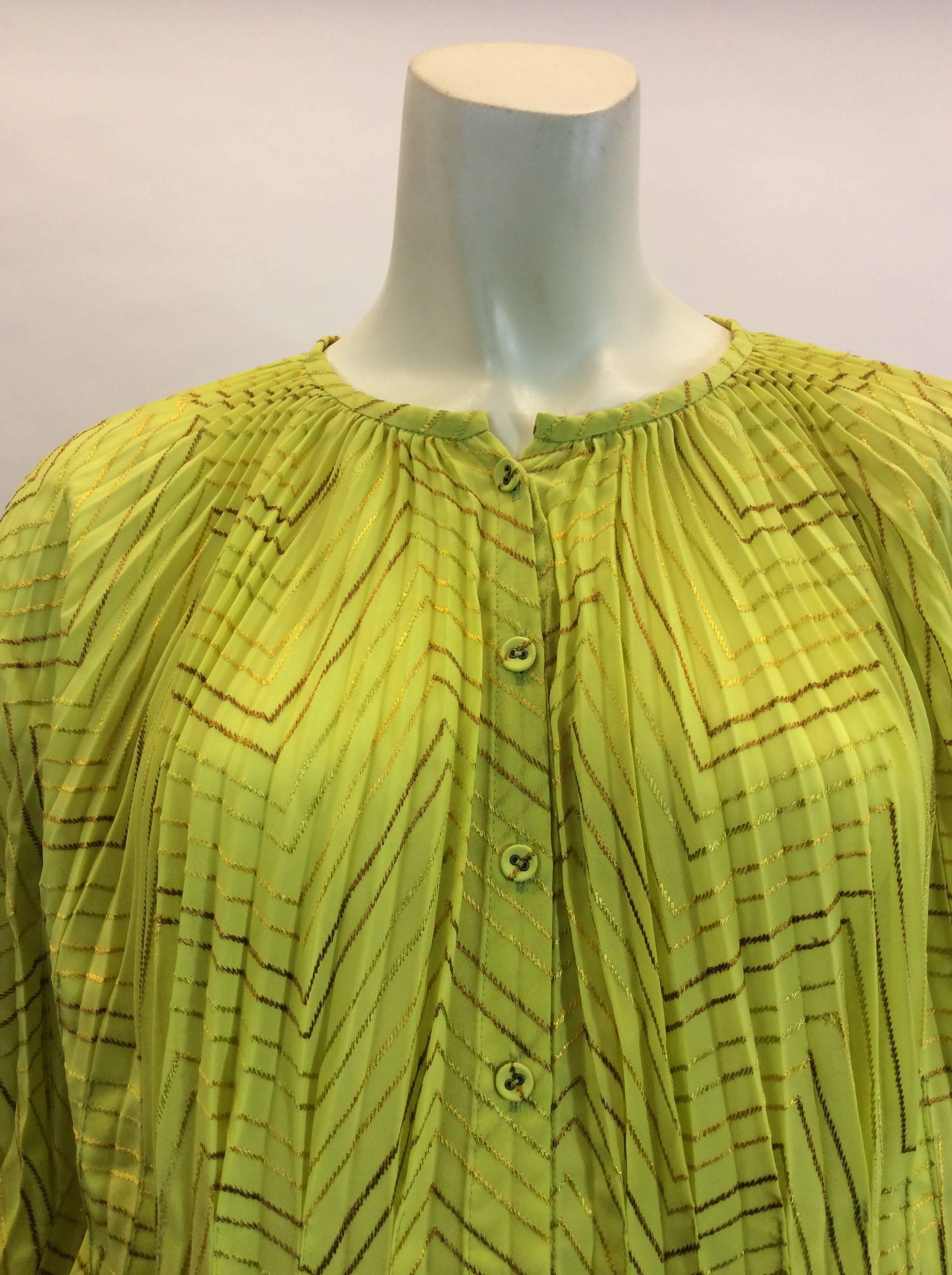 Issey Miyake
Yellow top with gold stitching
Buttondown
100% Polyester
Made in Japan
Intricate sleeve detailing - noted in photo