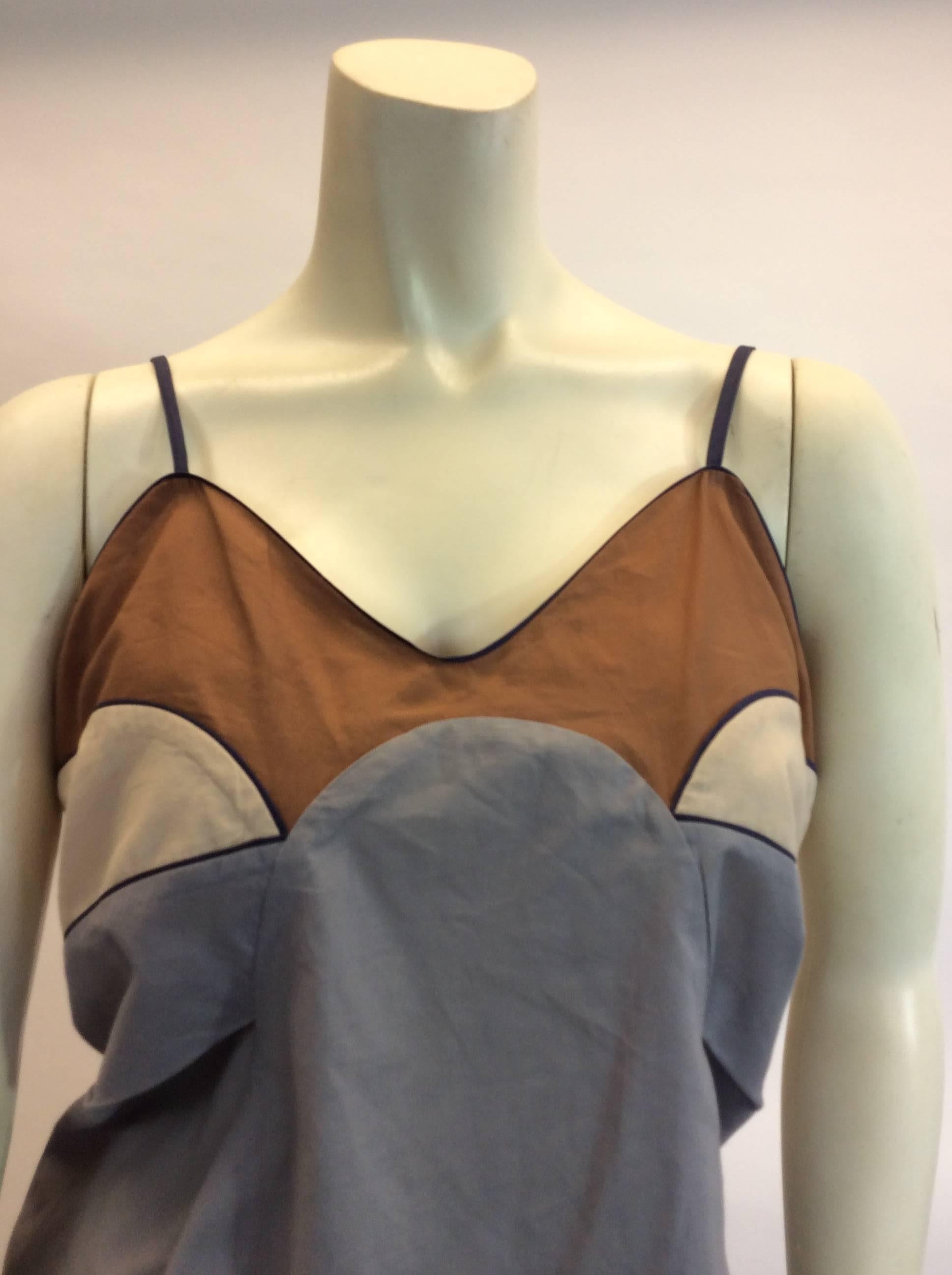 Marni Navy Trim Tank
Features tan, cream and gray color blocks
18 32 32
Made in italy
Size 42
100% cotton