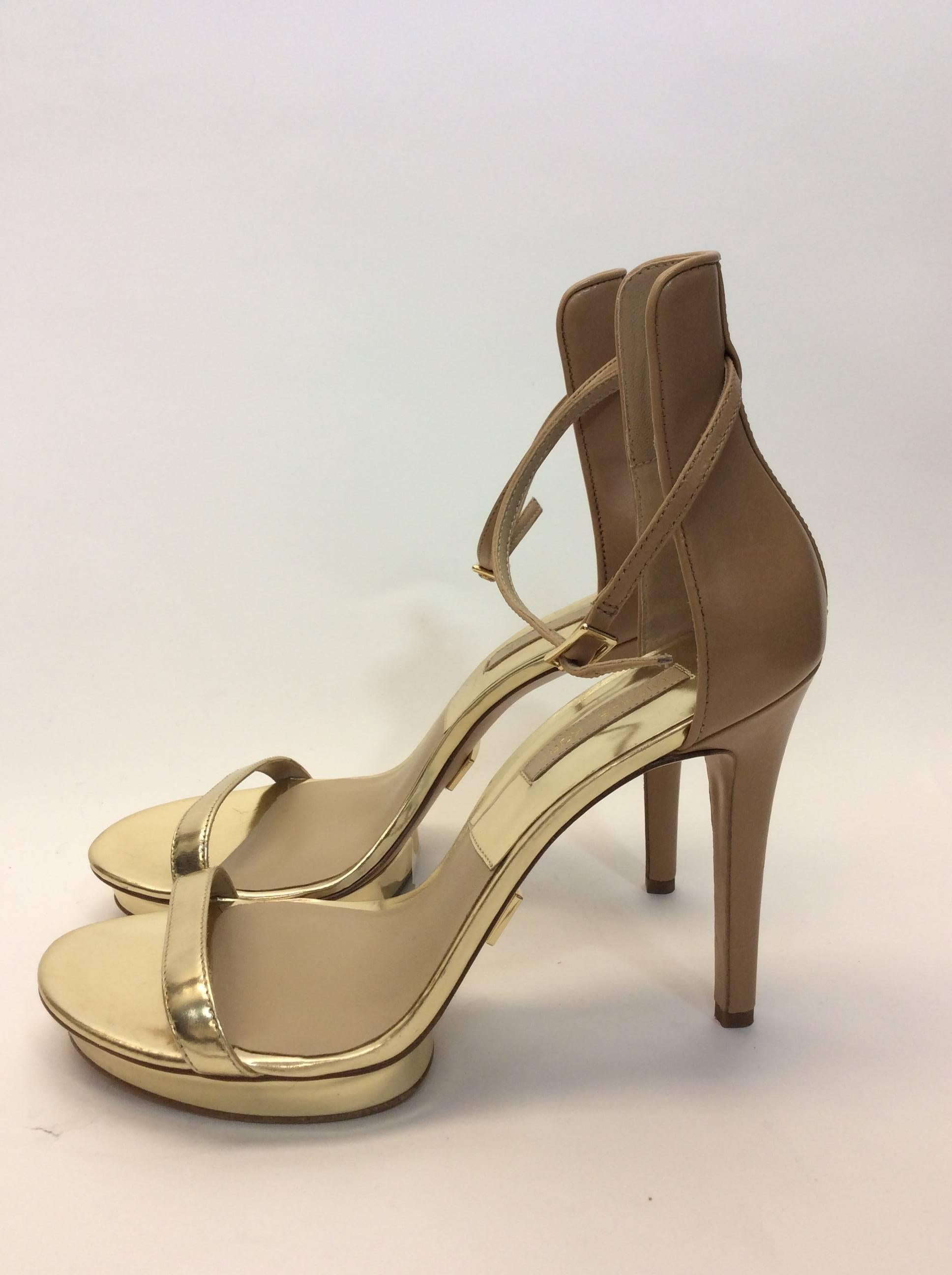 Michael Kors Gold Strap Heels
Nude leather ankle strap
Platform and stiletto style
Made in China
4 inch heel
Size 38.5