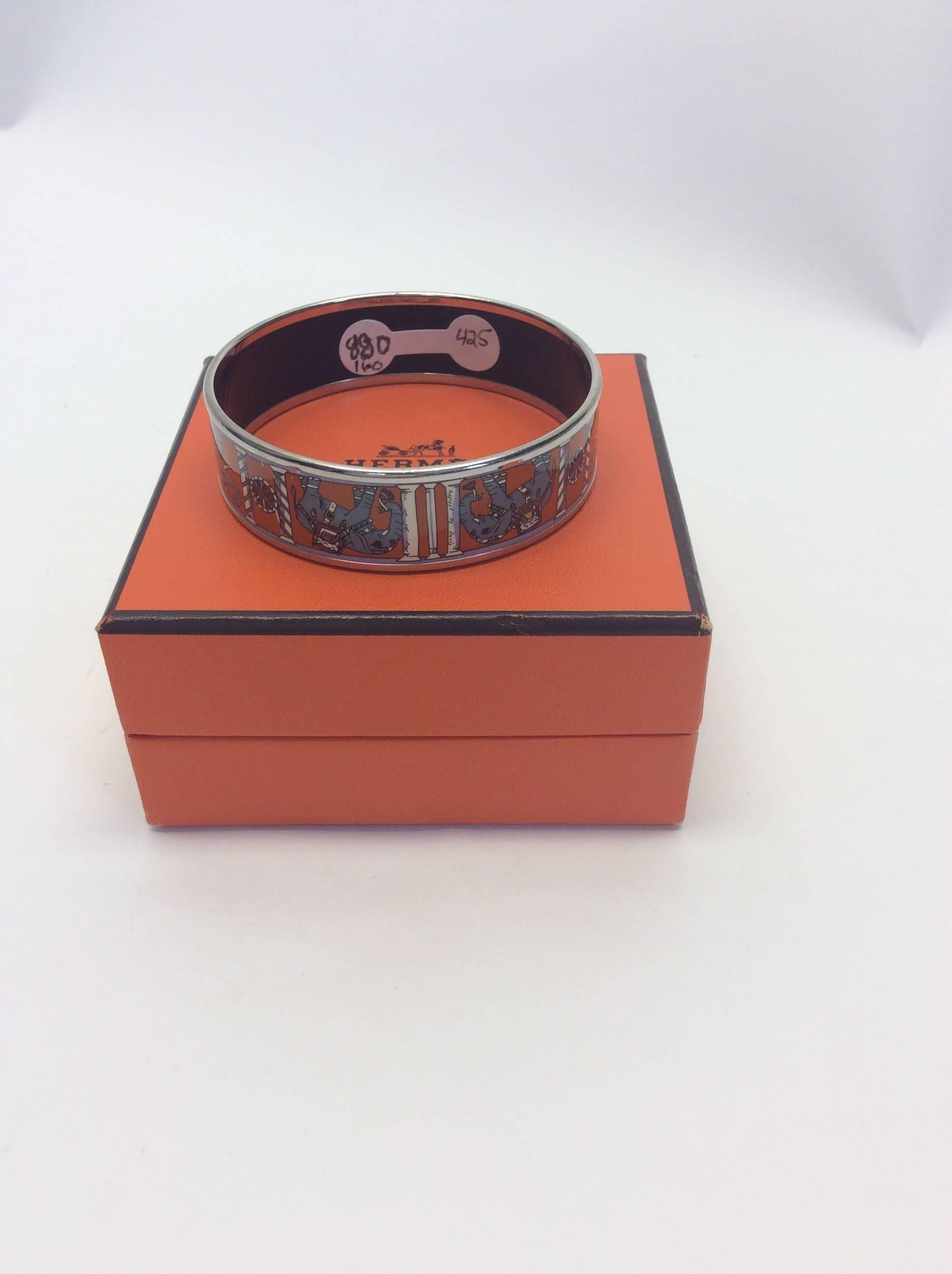 Hermes "Torana" Bangle
Elephant printed
Orange and silver
3 inches wide, 6 inches around
$425
Made in France
