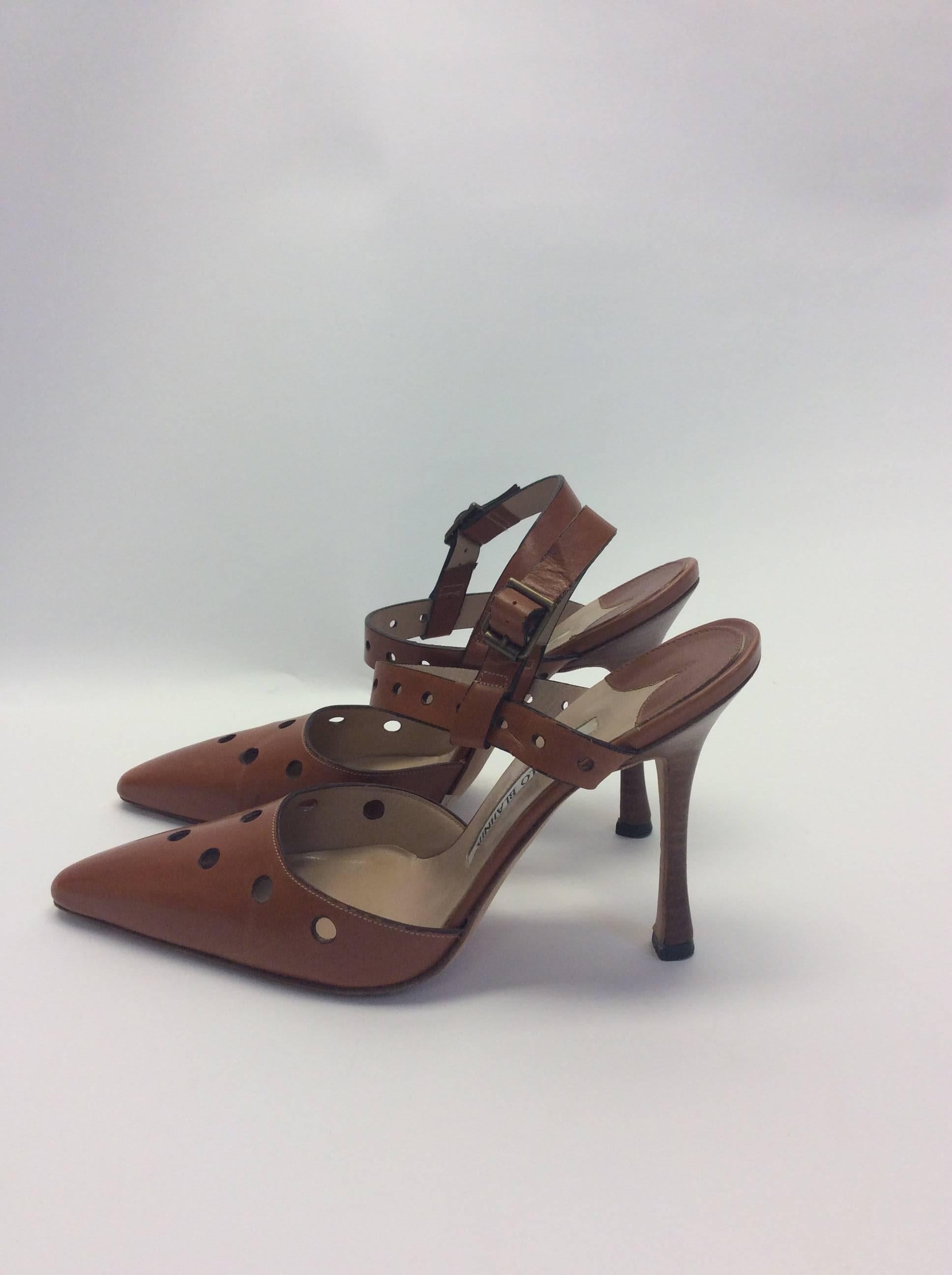 Manolo Blahnik Brown Leather Heels With Cutouts
Size 36
With box, original price $445
4 inch heel
Made in Italy
Circle cut out detailing in leather
