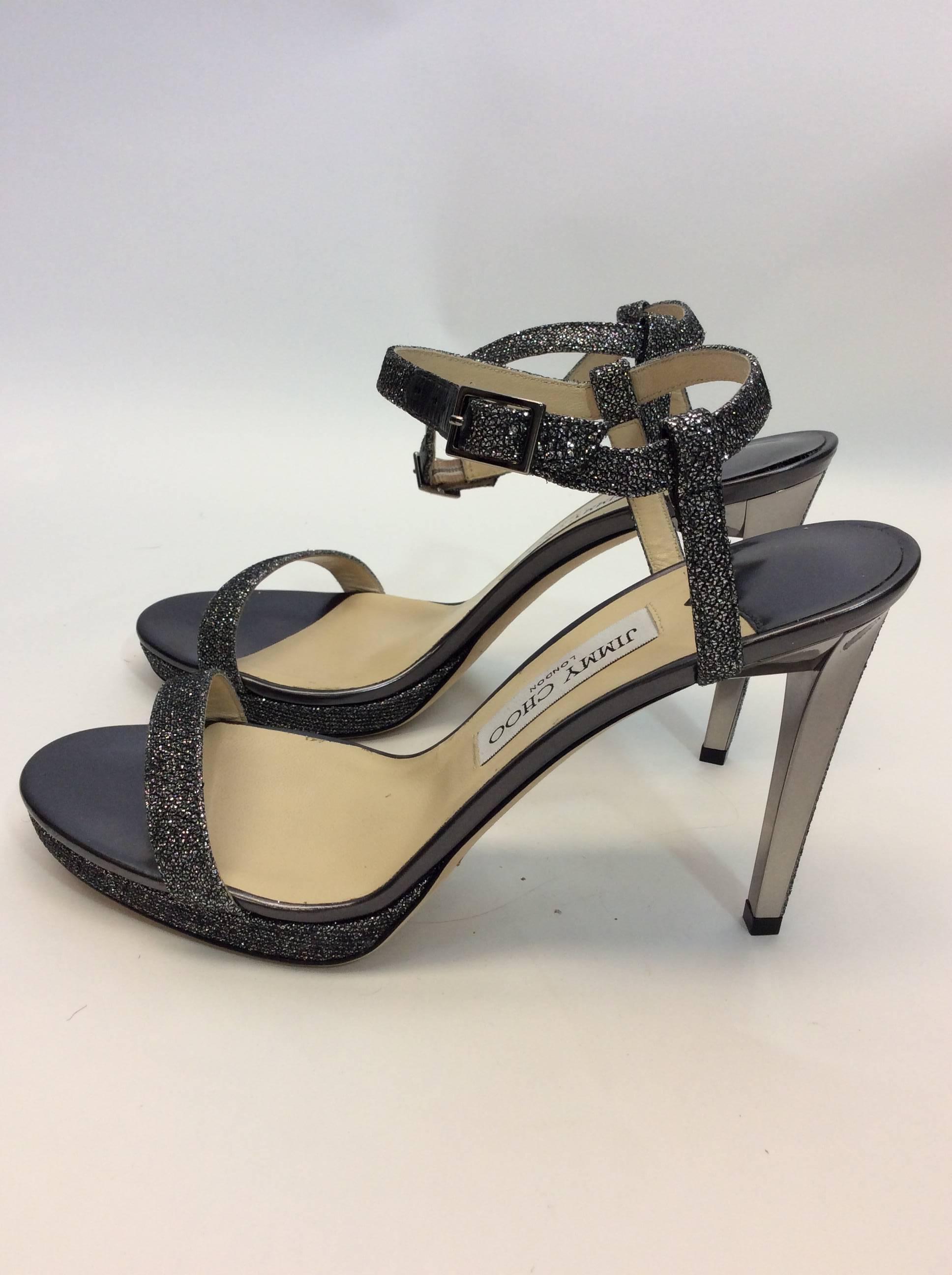 Jimmy Choo NIB Glitter Strap Heels
Size 39.5
Small buckle on the ankle strap
4.25 inch heel
Mirrored heel with silver glitter strip
$400
Made in Italy