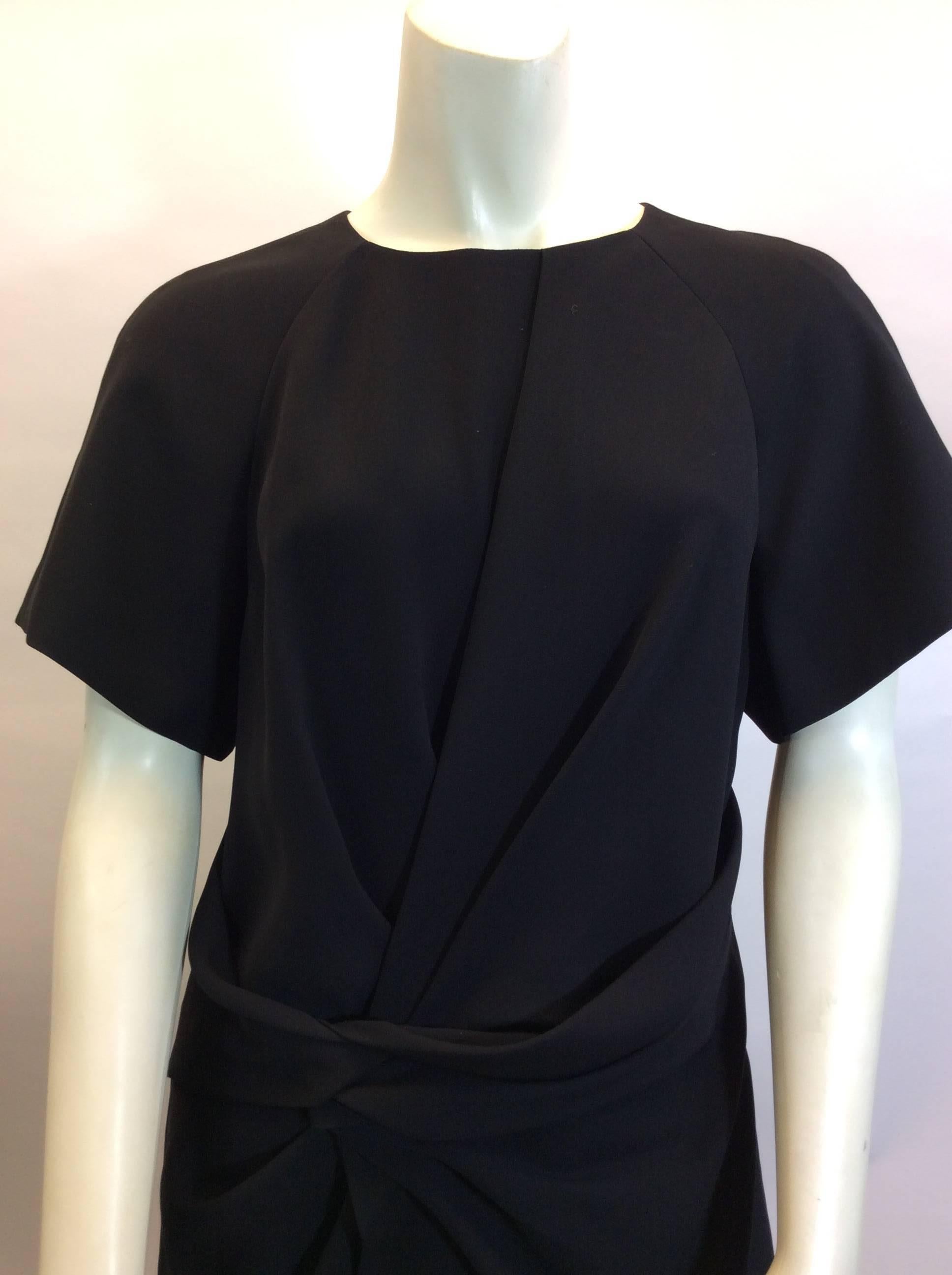 Alexander Wang Black Detailed Waist Blouse
Short sleeves, cinched waist detail
Longer style blouse
Exterior is polyester, lining is also polyester
Made in China
Size 10
