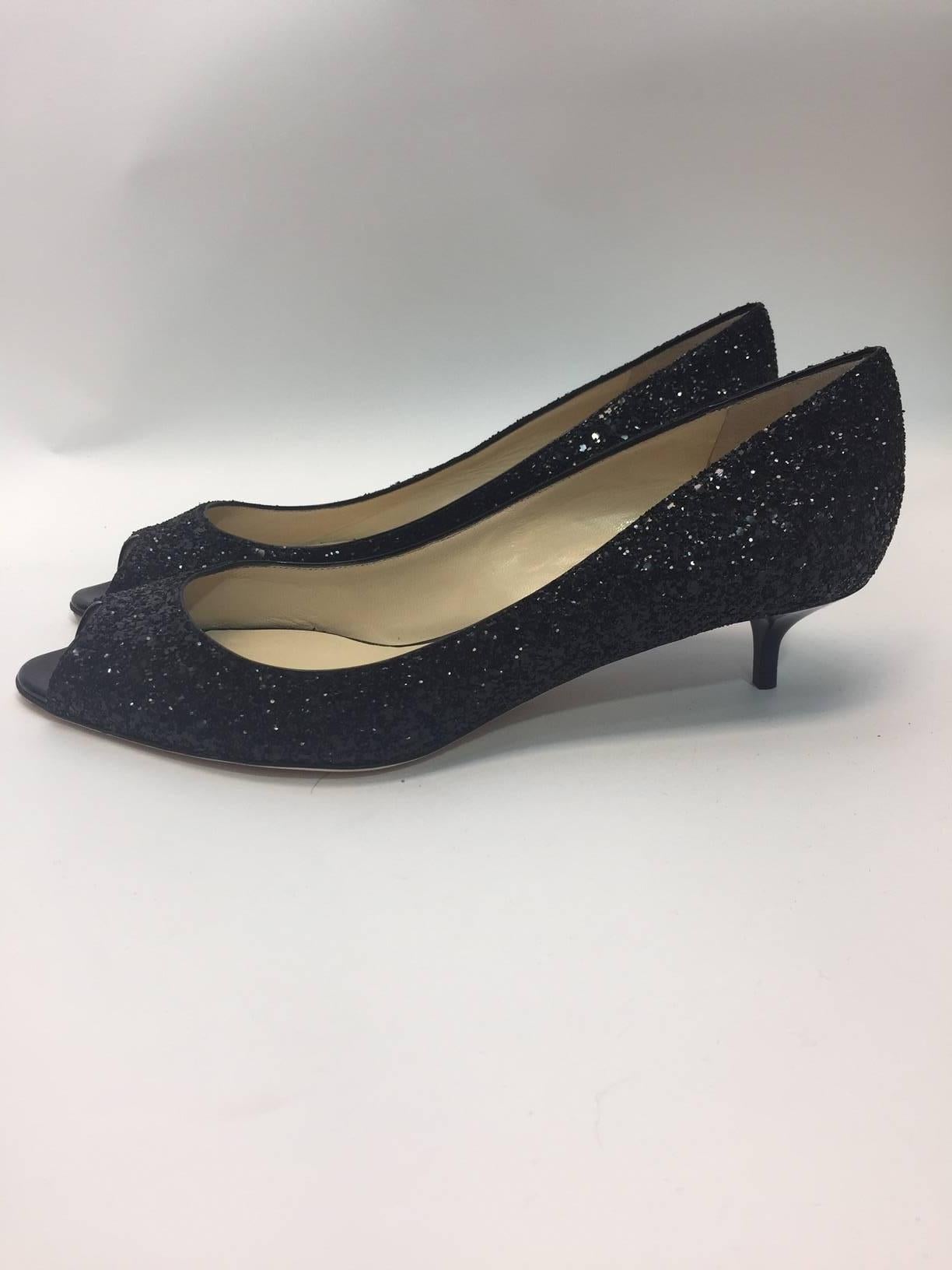 Jimmy Choo New Black Glitter Kitten Heels
Peep toe style
Made in Italy
Size 40.5
$499

