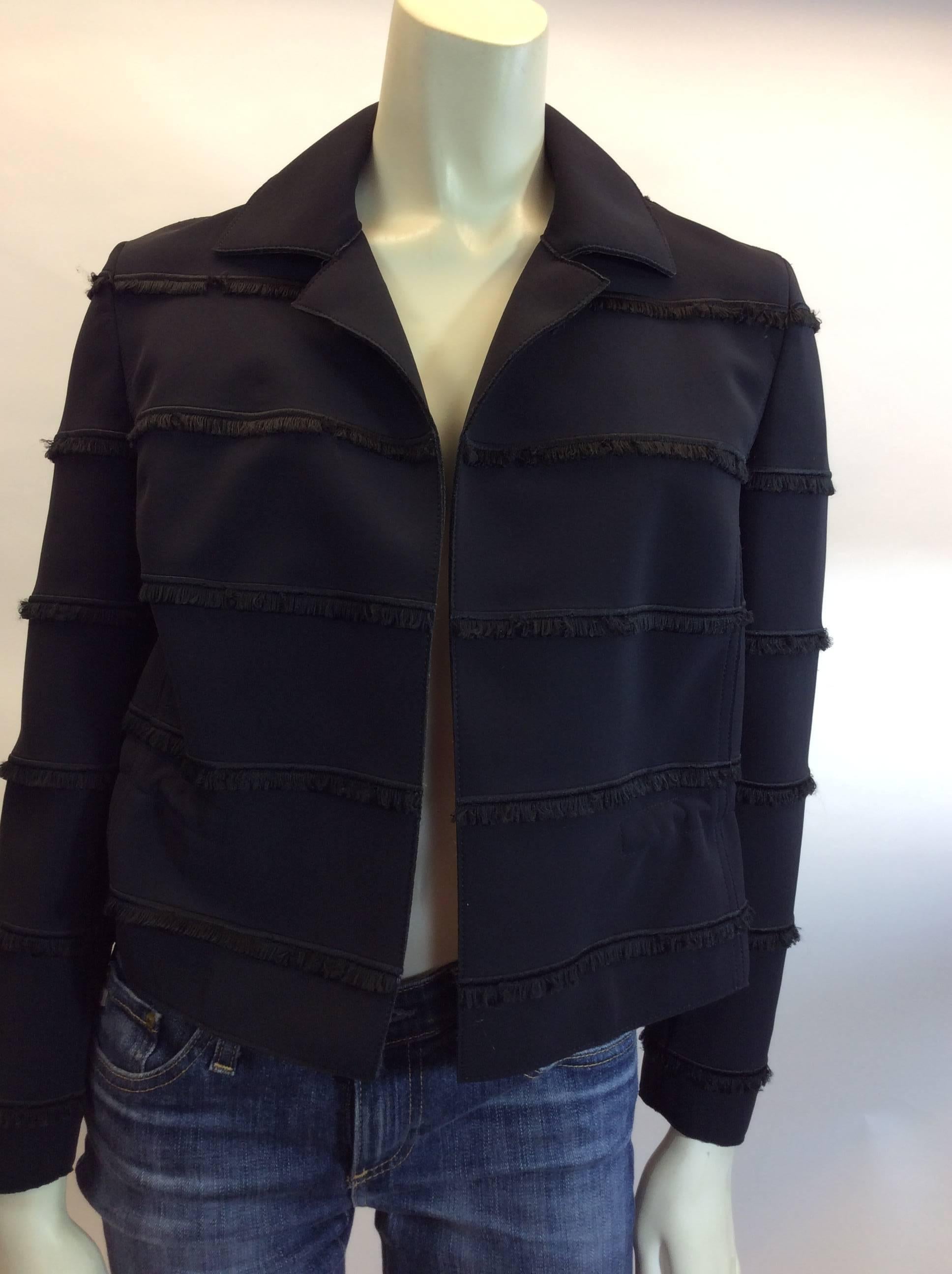 Akris Black Fringe Jacket
Size 4
$178
Fringe trim
Exterior - Polyester, Nylon & Elastane
Interior Lining - Polyester & Elastane
Made in Romania
