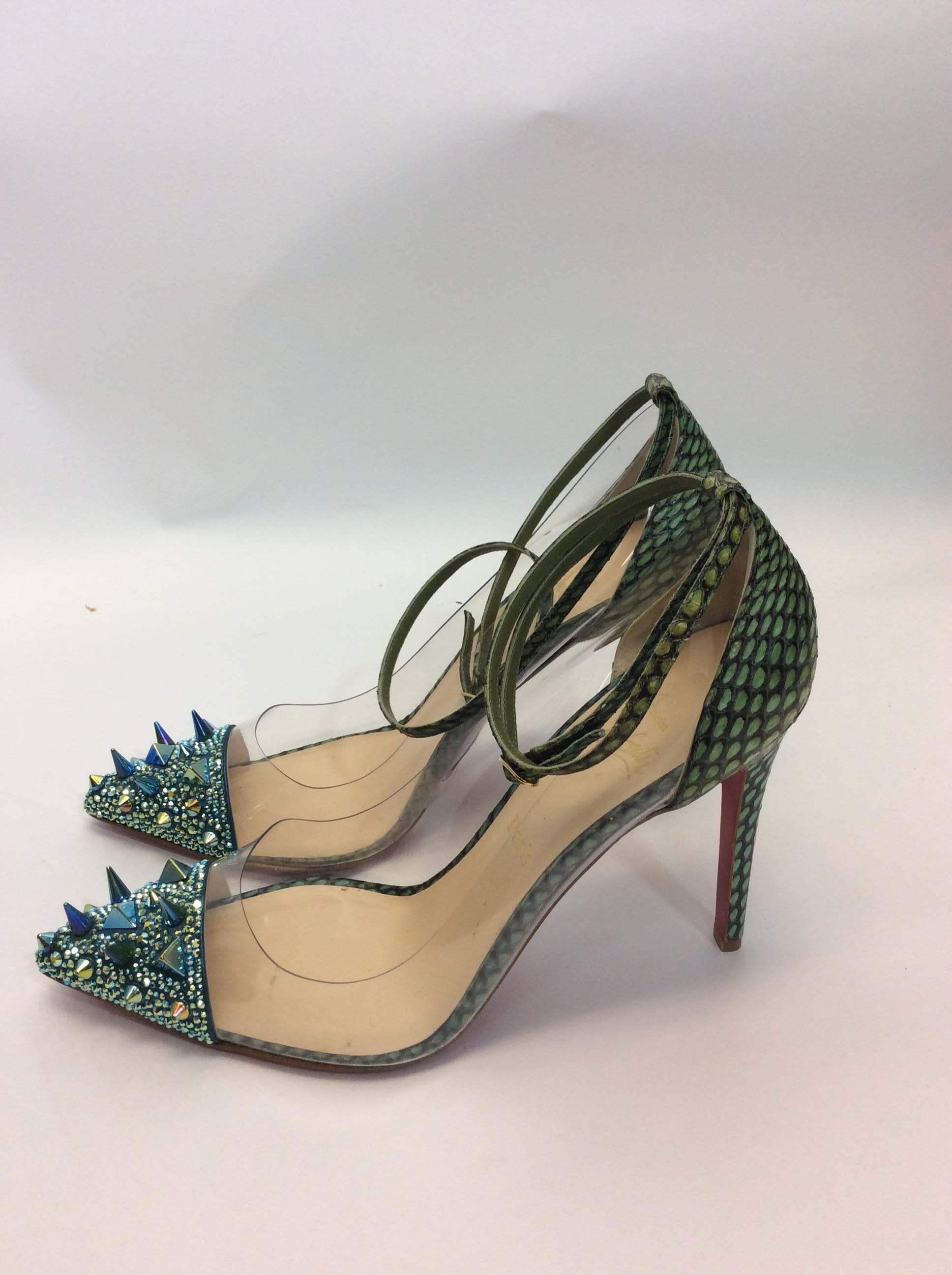 Christian Louboutin NIB Just Picks 100 Pot Pourri PVC Cobra Version Green Pumps
New in Box
Size 41
Original Price: $1,995
Heel is 4.5 inches
Exposed python detailing on heel 
Double wrap ankle strap
