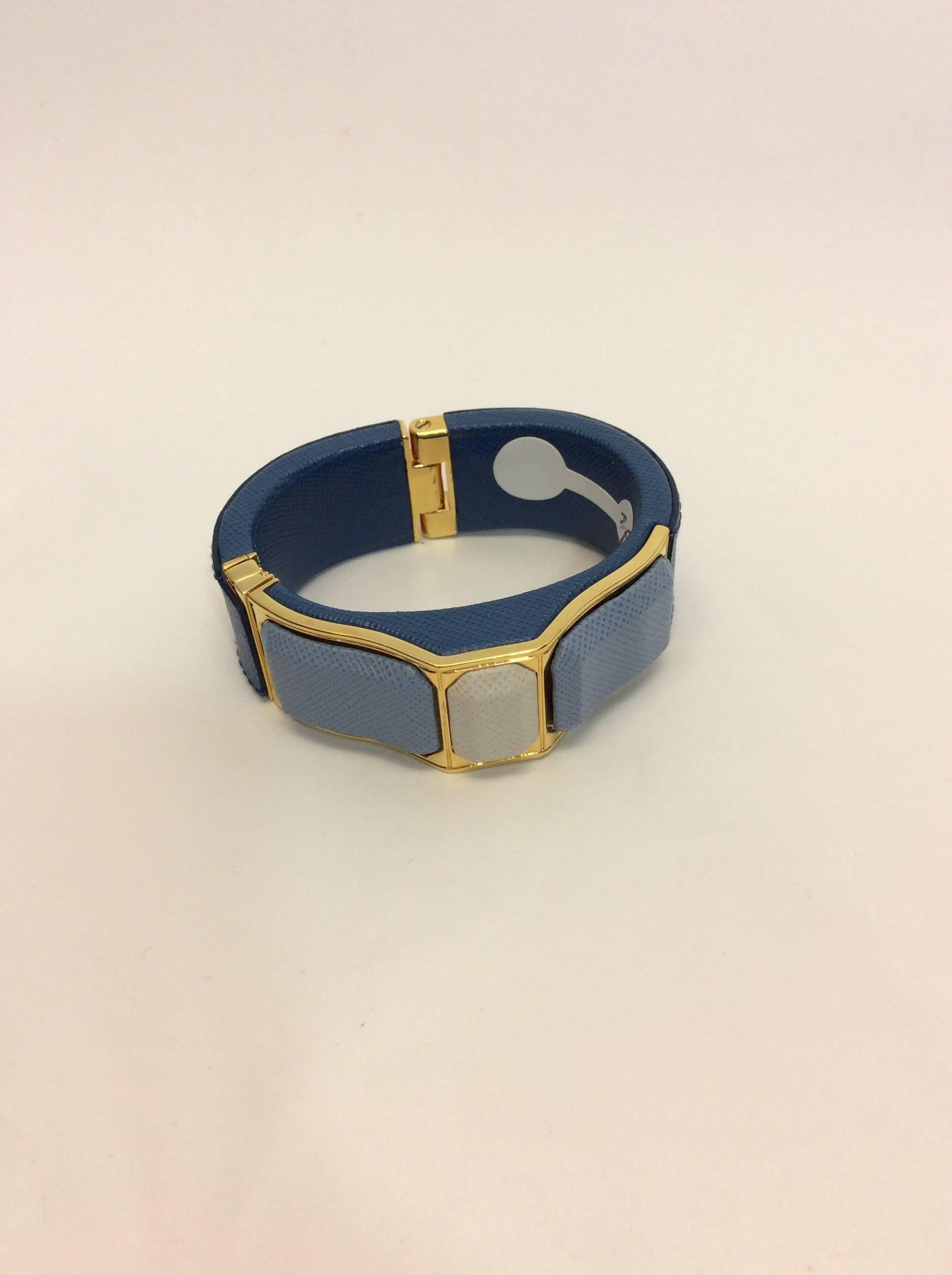 Prada Blue Leather Cuff
$350
7 inch diamete
Gold hardware
Clasp closure
Features three blue hue leather stones
Made in Italy