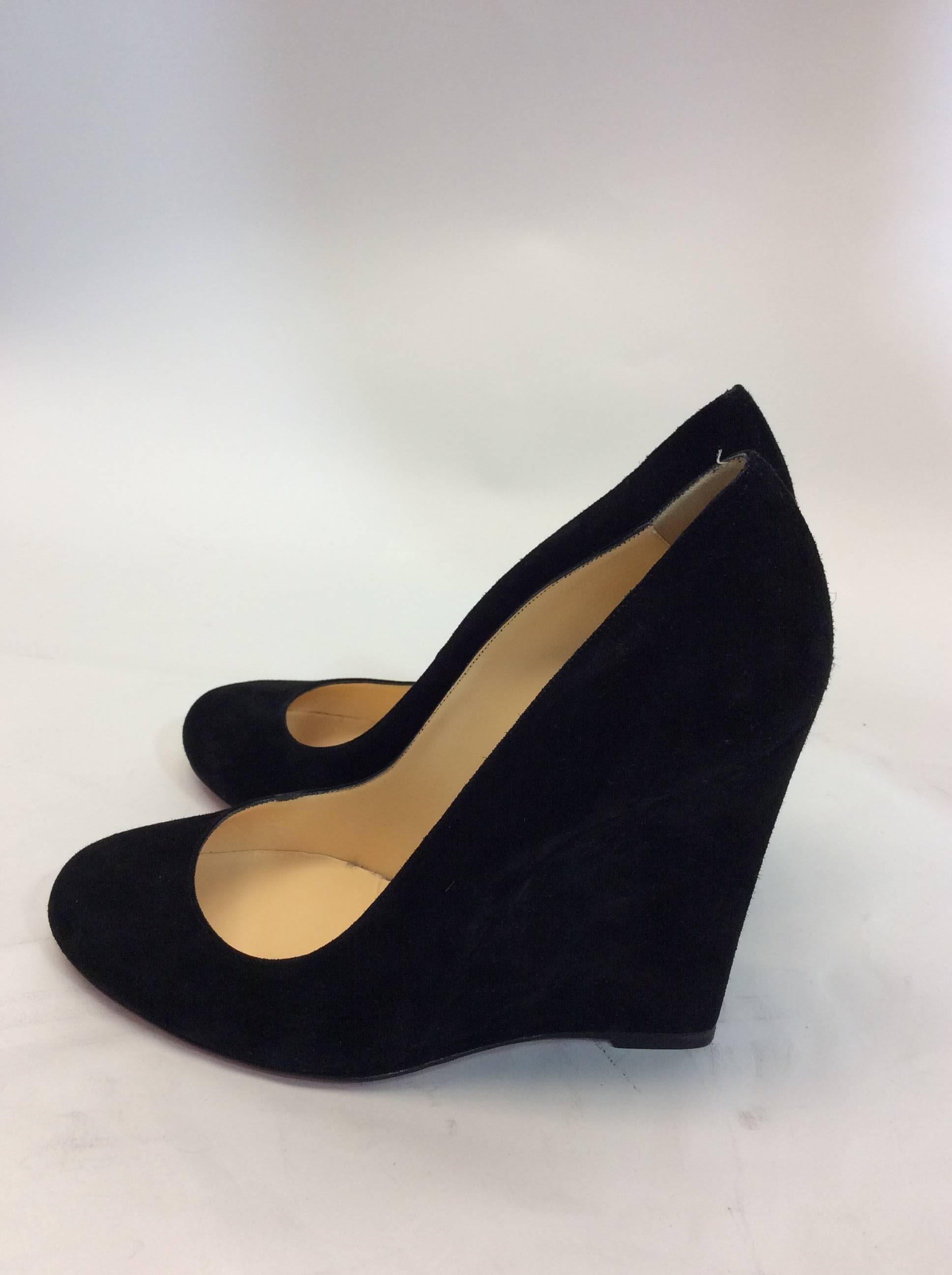 Christian Louboutin Black Suede Closed Toe Wedge
4.5 inch wedge
$450
Made in France
Size 38.5
