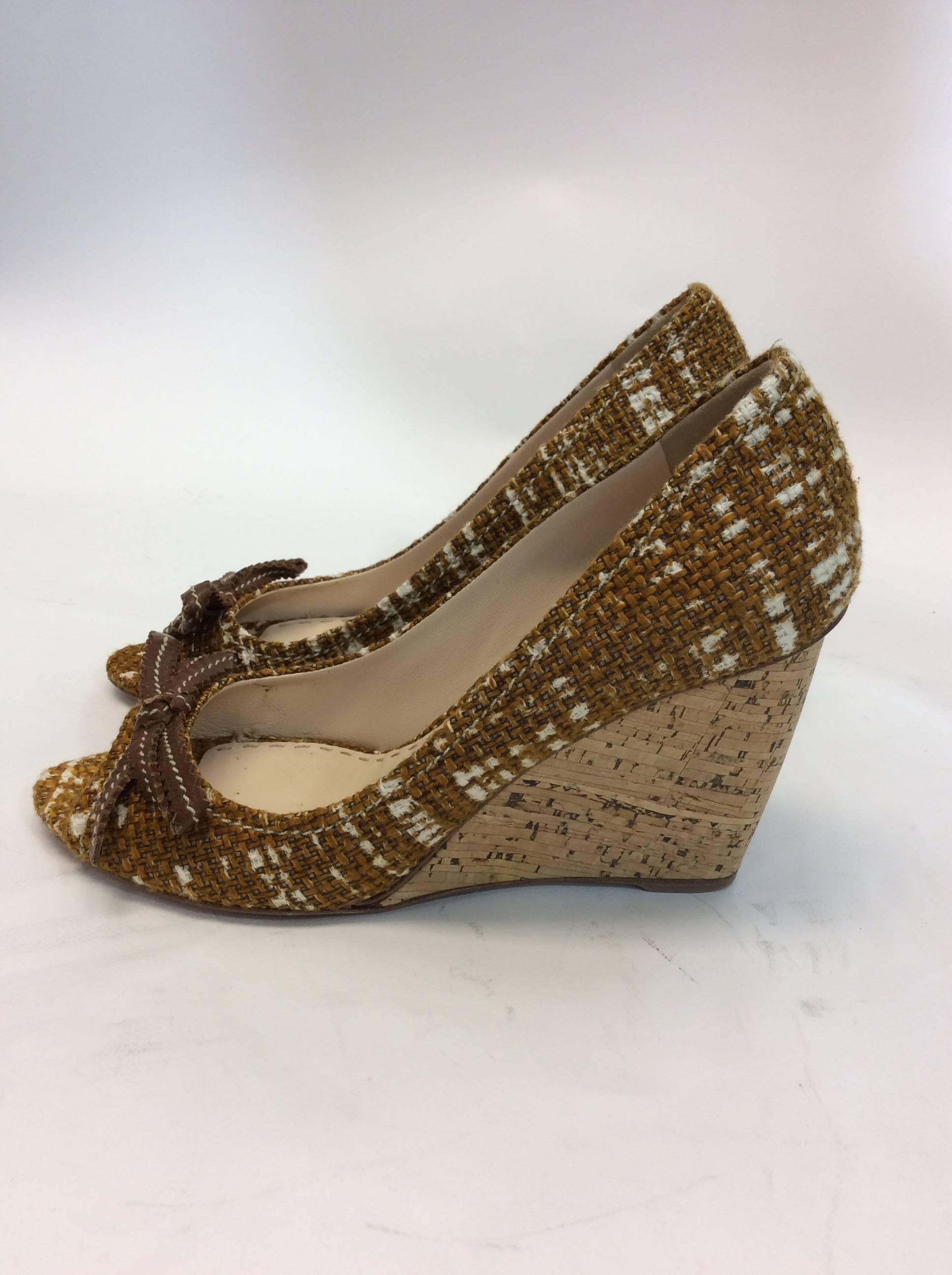 Prada Tweed Peep Toe Wedge
4 inch cork wedge
Tweed material, features leather brown bow on toe
Comes with box
Made in Italy
