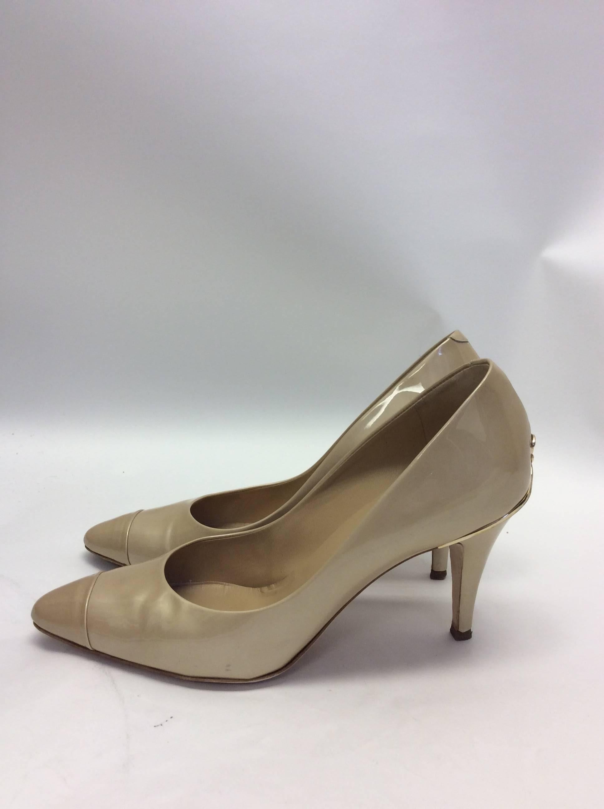 Chanel Patent Leather Cream Pumps
Size 39.5
Original price: $675
3.5 inch heel
Gold metal detail on back of both heels
