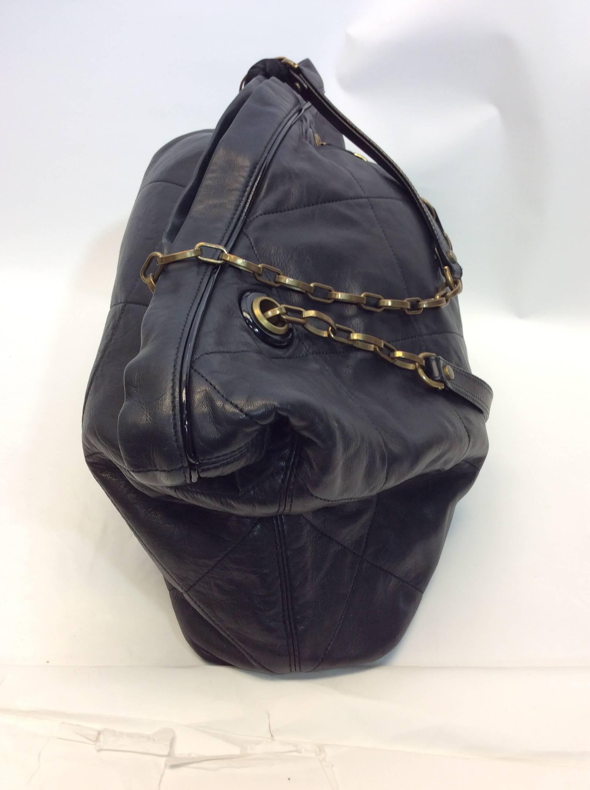 Lanvin Quilted Leather Large Chain Link Purse
$550
Chain link straps are interwoven with ribbon 
Magnetic closure
Made in Italy
Interior pocket