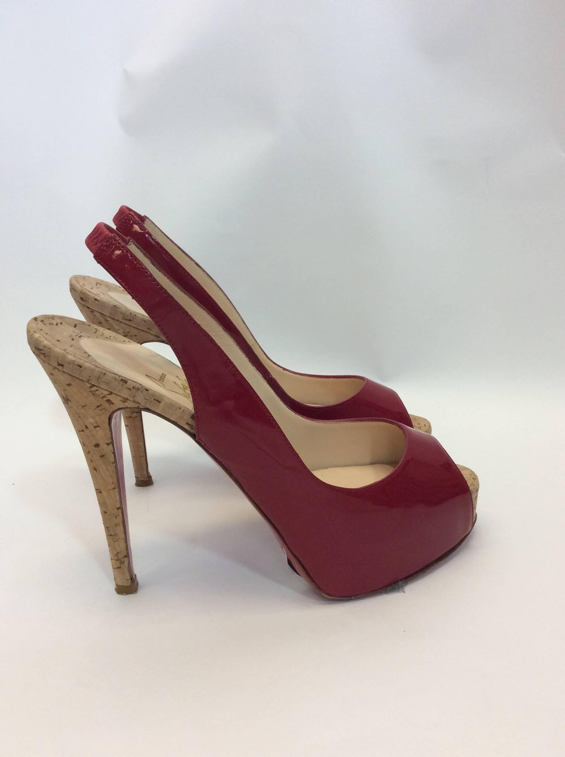 Christian Louboutin Patent Leather Peep Toe Pumps
Red patent leather
Cork material base
Size 37
$350
5 inch heel
Made in France