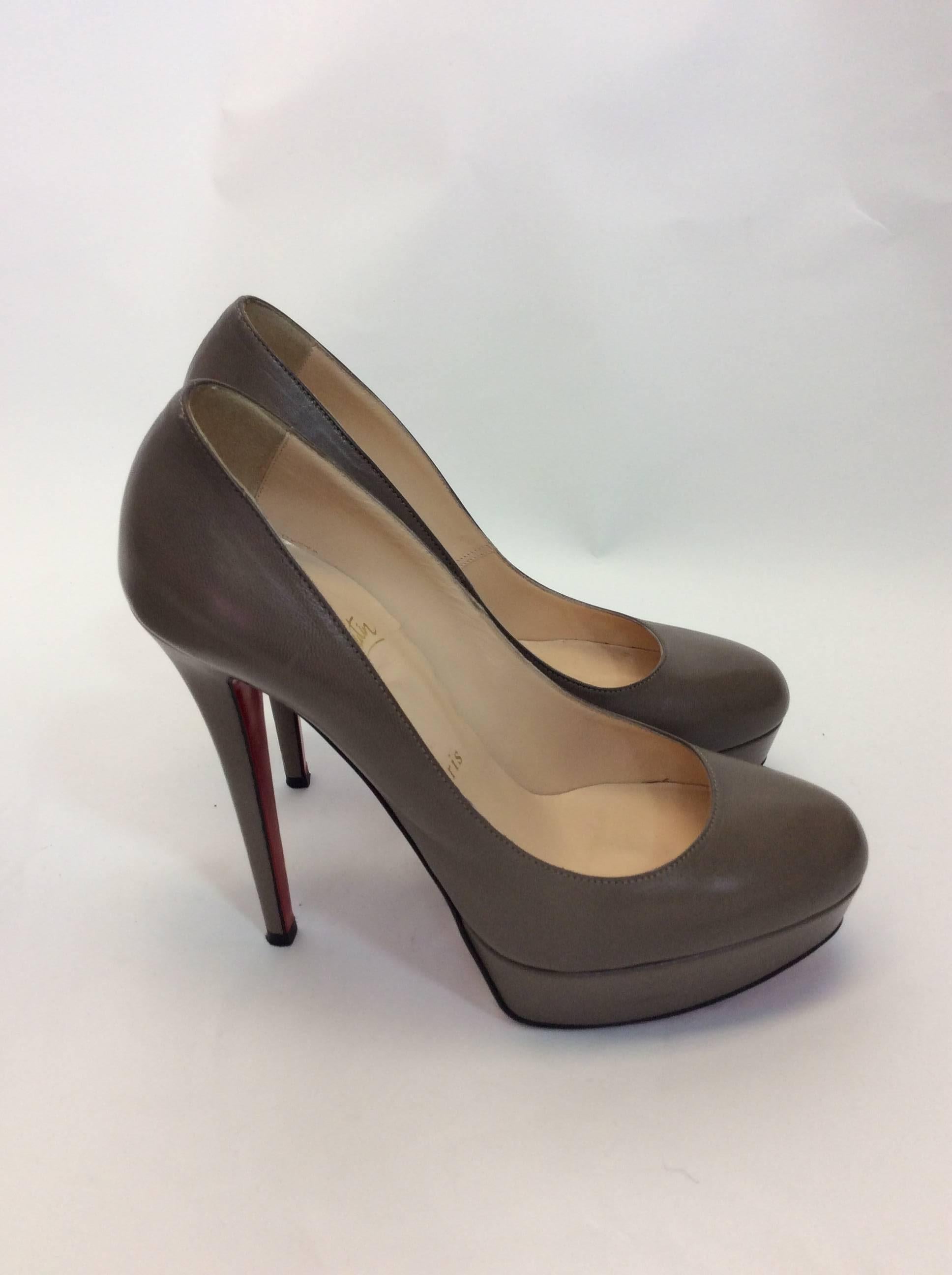 Christian Louboutin Gray Leather Platform Pumps
Size 7.5
$350
5 inch heel, 1.5 inch platform
