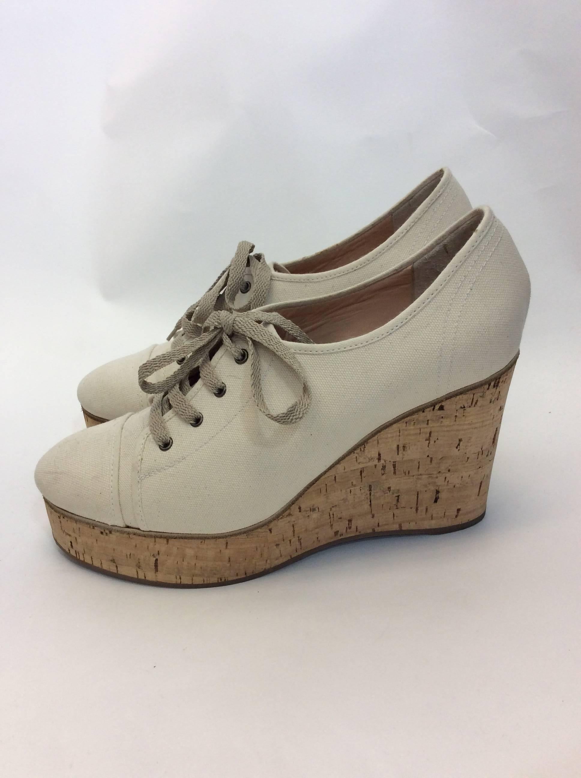 Chloe Cream Canvas Lace Up Wedge
4 inch wedge
$225
Size 39.5 
Off white/Cream
