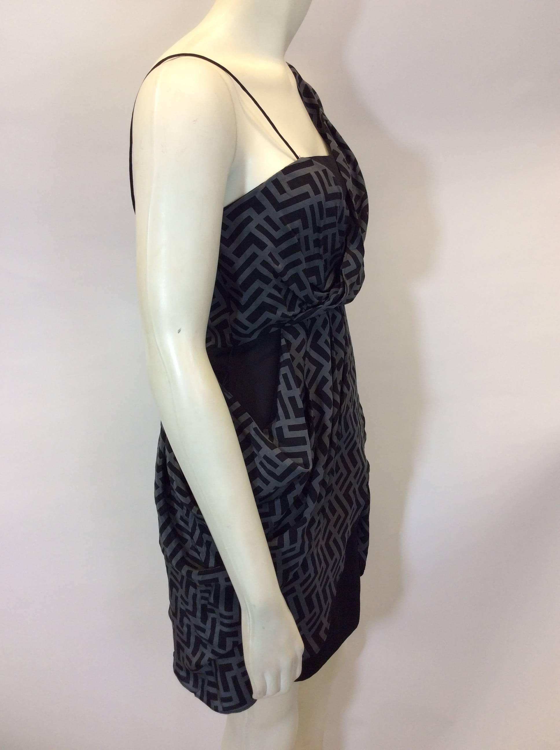 Chevron Print Asymmetrical Dress
Silky lining and under dress
Draped chevron print overlay
Asymmetrical draped design
Back zipper closure
Size unknown, view measurements
100% Silk Shell, 100% Polyester Lining