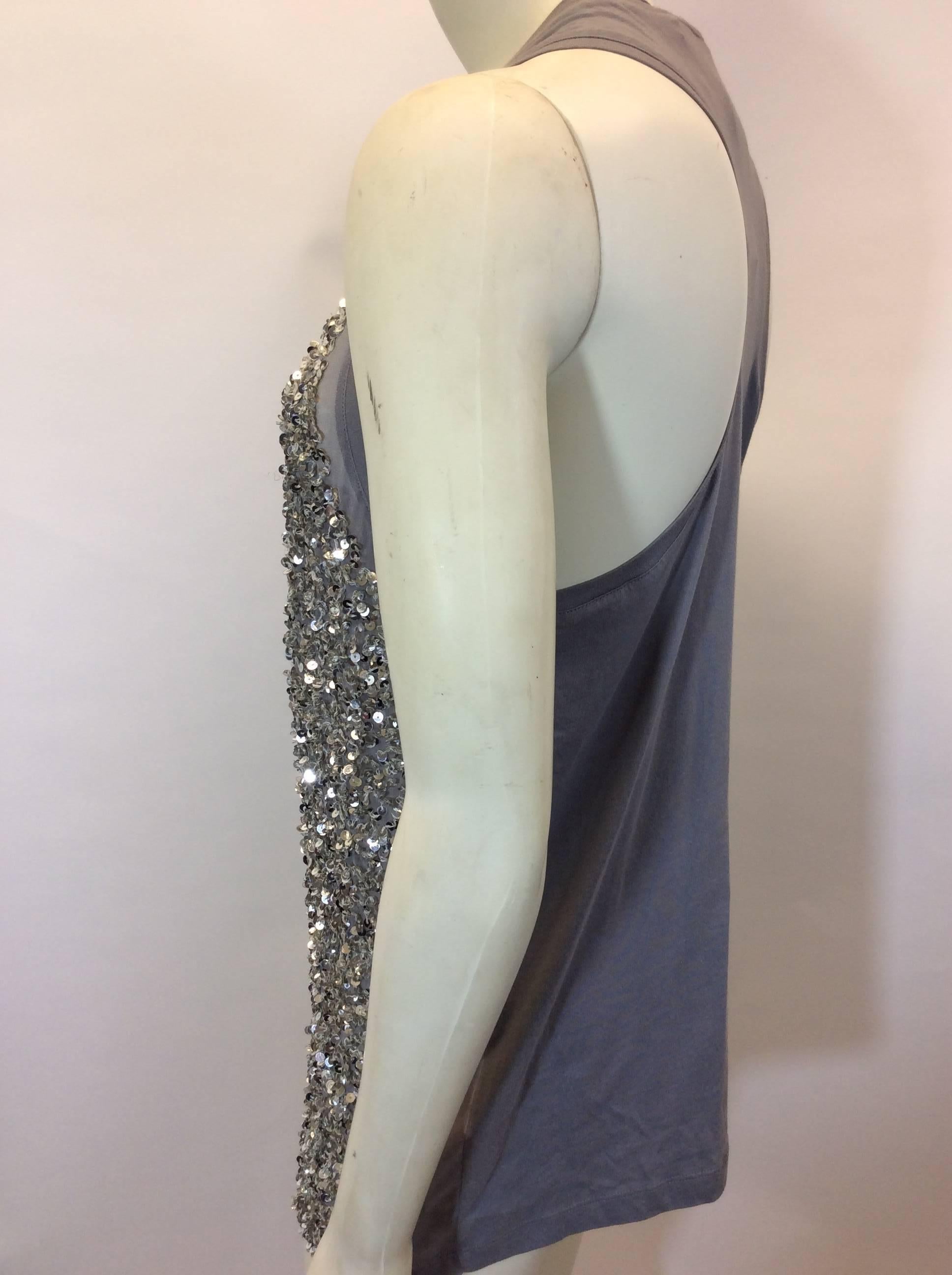 Sequined Grey Tank
Tunic length
Sequin front detail
Stretch back fabric
Racer back neckline
Size 38
100% Silk front, 100% Cotton backing