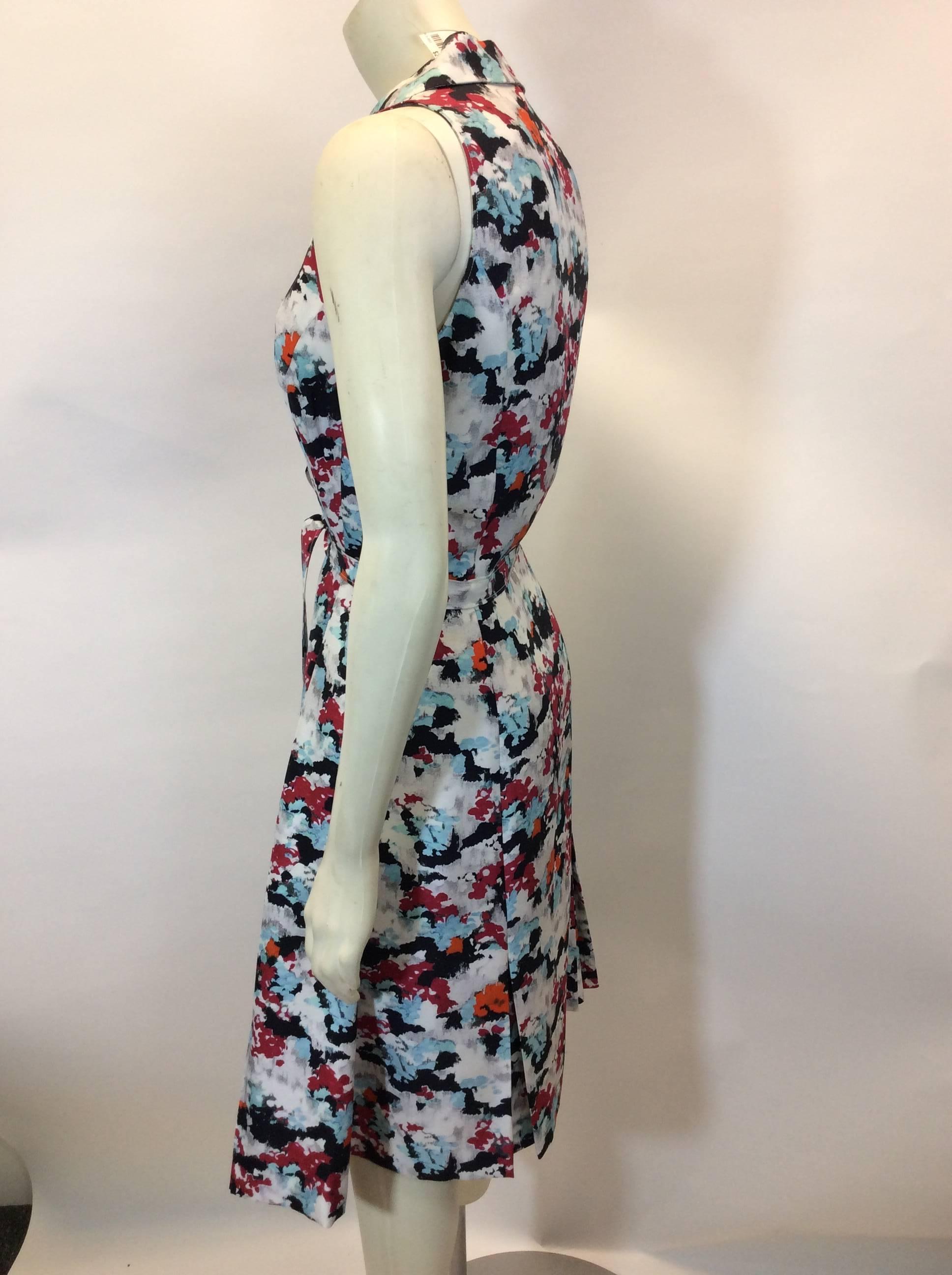 Abstract Printed Day Dress
Front button closure
Features wrap tie for waist
Button detailing on skirt
Collar neckline
Size 8
100% Silk