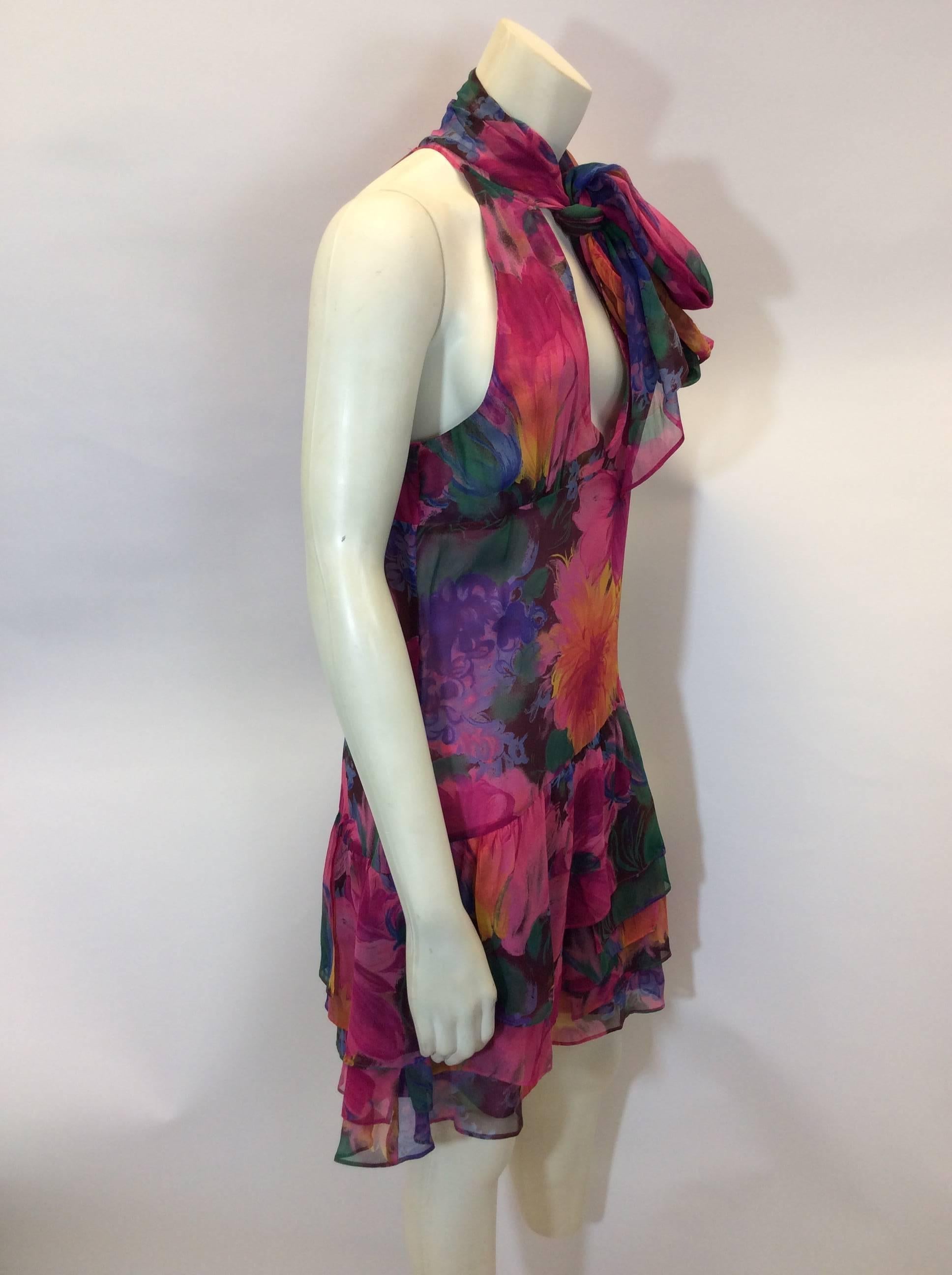 Floral Chiffon Ruffle Dress with Scarf
Side zipper closure
Translucent tie scarf attached
Size 42
100% Silk