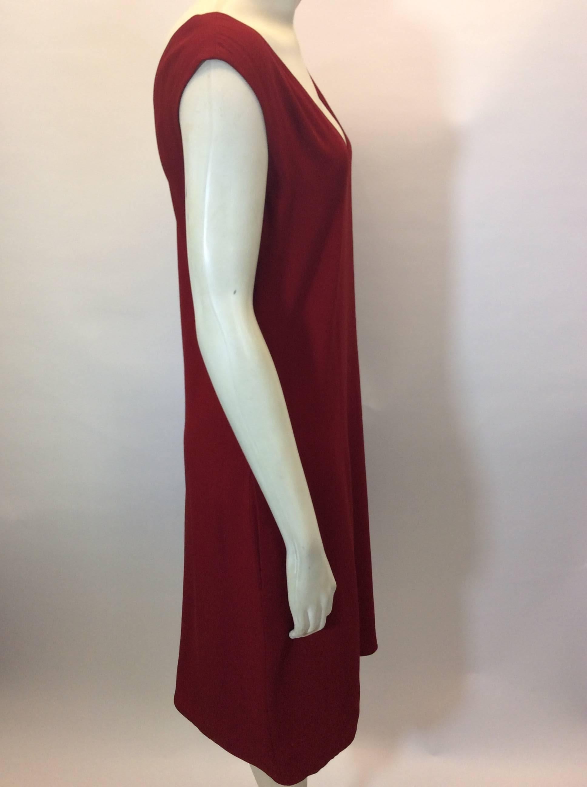 Red V-Neck Sheath Dress
Pullover fit
Knee length
Features two side seam pockets
Size 36
58% Viscose, 47% Acetate