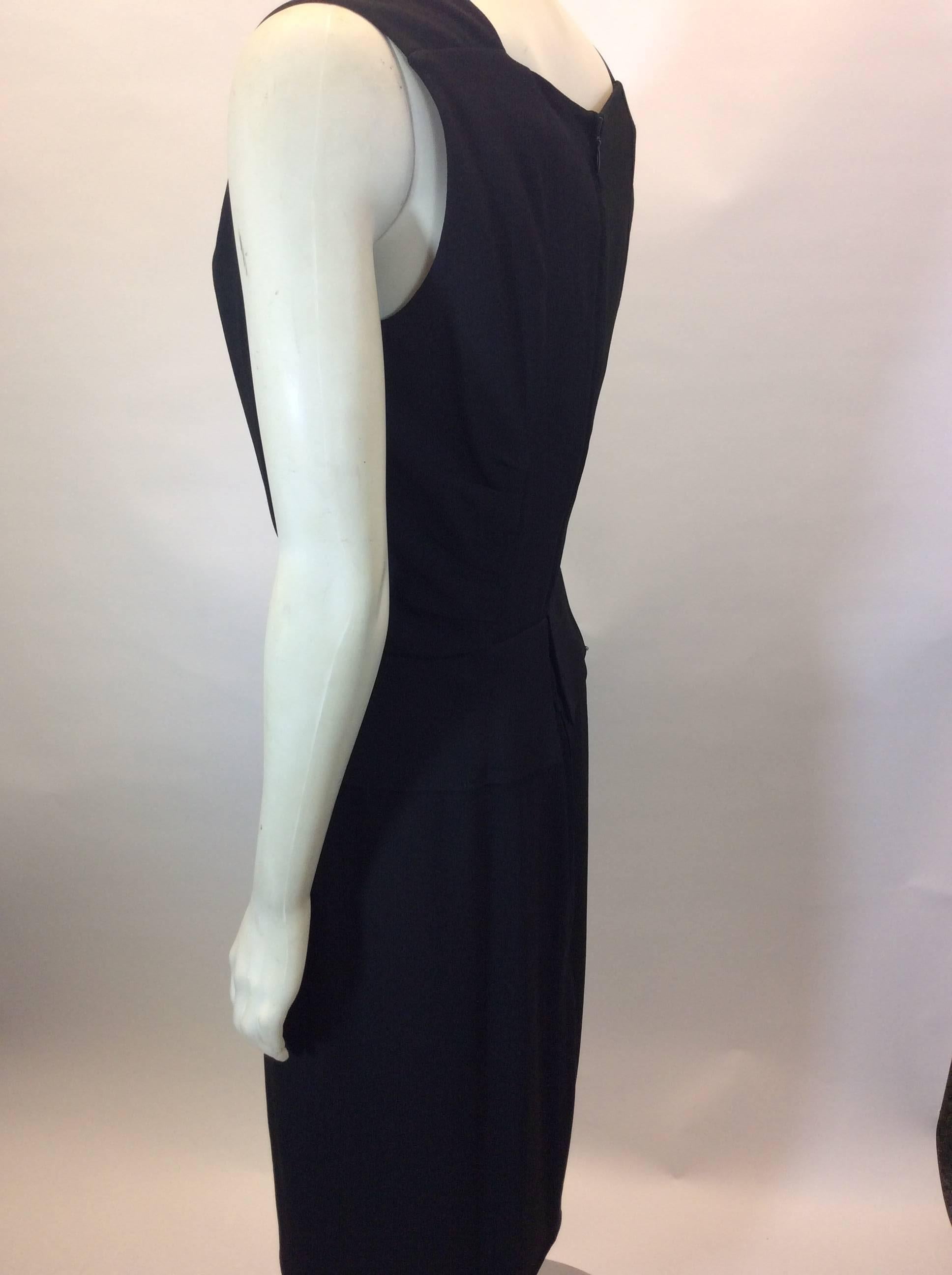 Black V-Neck Dress with Peplum Detail
Center back zipper closure
Small peplum detail on waistline
Sleeveless
Size and fiber content unknown (refer to measurements)
