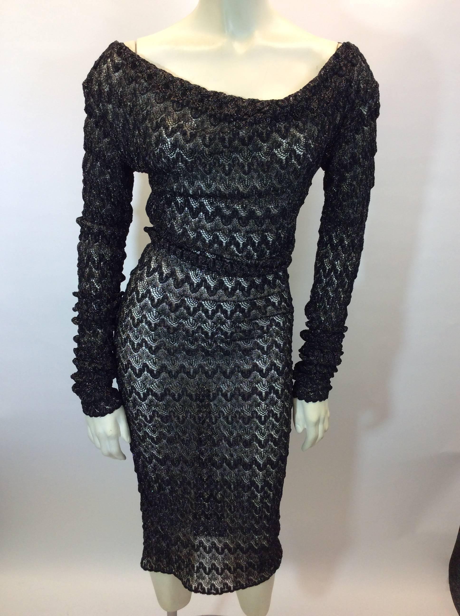 Black Metallic Lace Knit Stretch Dress
See through design
Can be worn on or off the shoulder
Knee length
Long sleeved
Size 40
Fiber content unknown