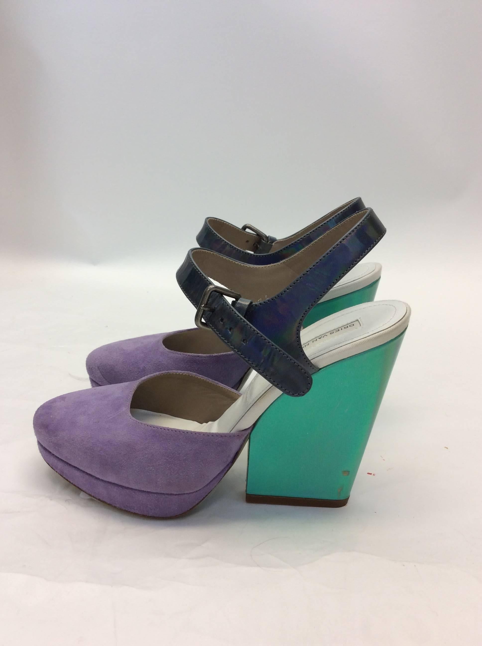 Dries Van Noten Suede Metallic Heels
Size 6
Original price: $545
Our price: $285
Blue metallic heel, suede lavender 
5.5 inch heel, 2.75 width
Features ankle strap
**Minor wear on heel, noted in photo