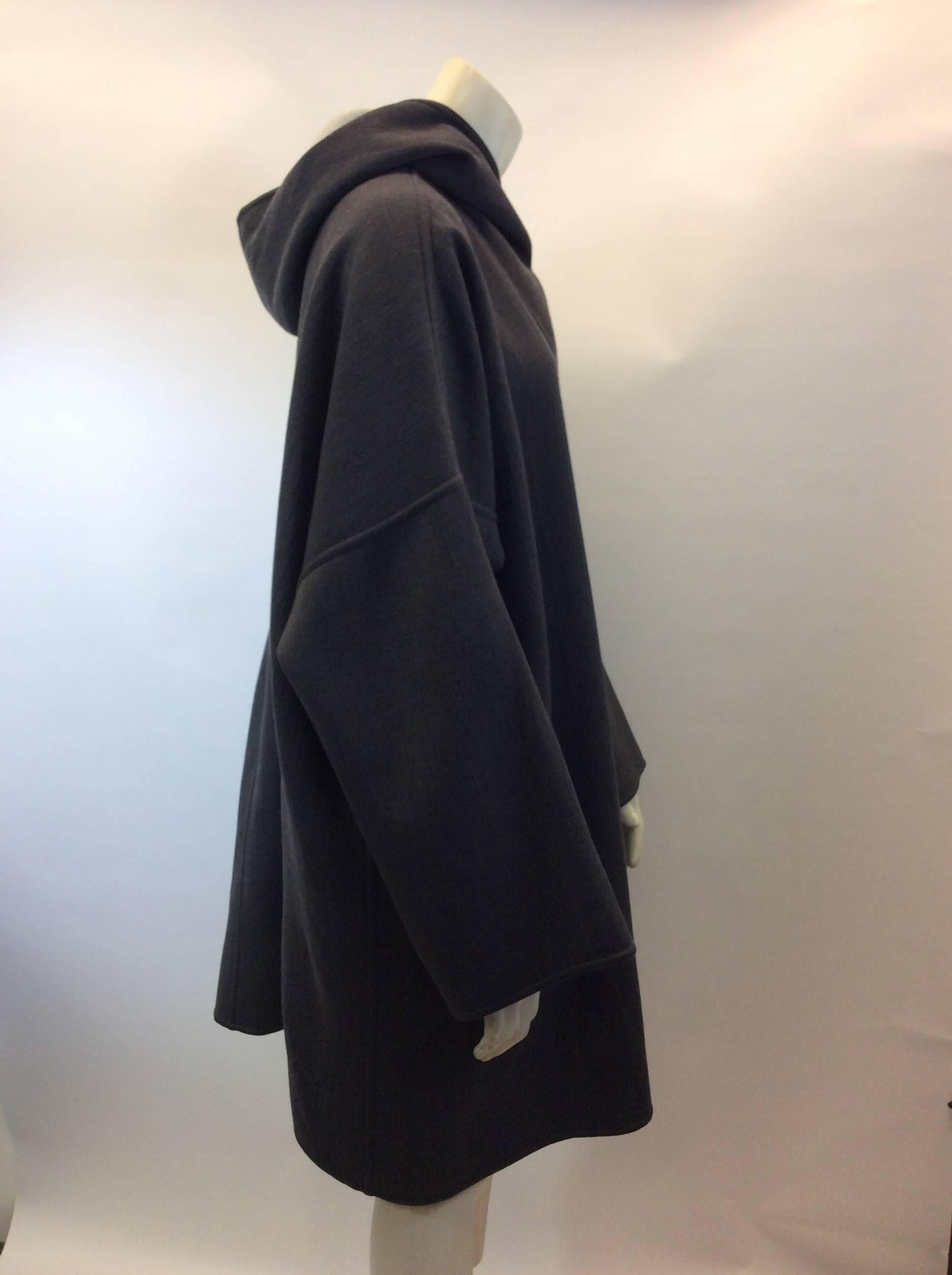 Giorgio Armani Oversize Hooded Topcoat
$499
Made in Italy
Wool
3 large buttons and one around the neck 
2 front pockets
