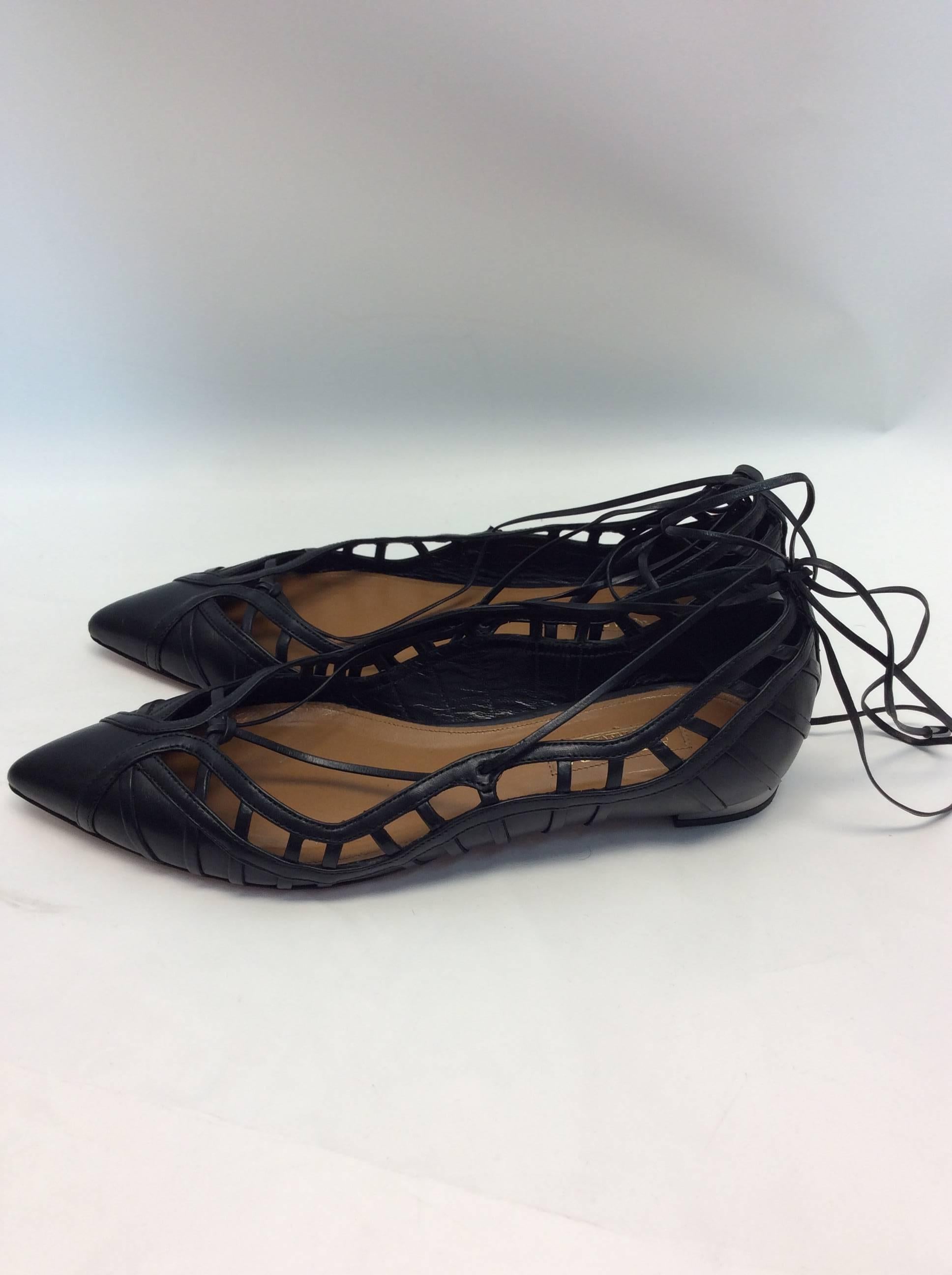 Aquazzura Black Leather Lace Up Flats
$550
Size 36
Black leather cut outs, black leather lace up ankle straps
Made in Italy
