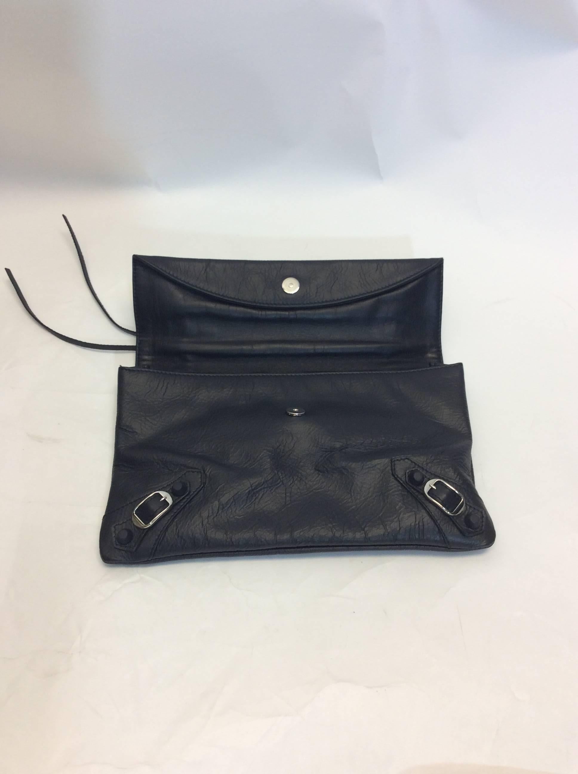 Balenciaga Black Fold Over Clutch
Small mirror included
$850
Made in Italy
Traditional Balenciaga hardware