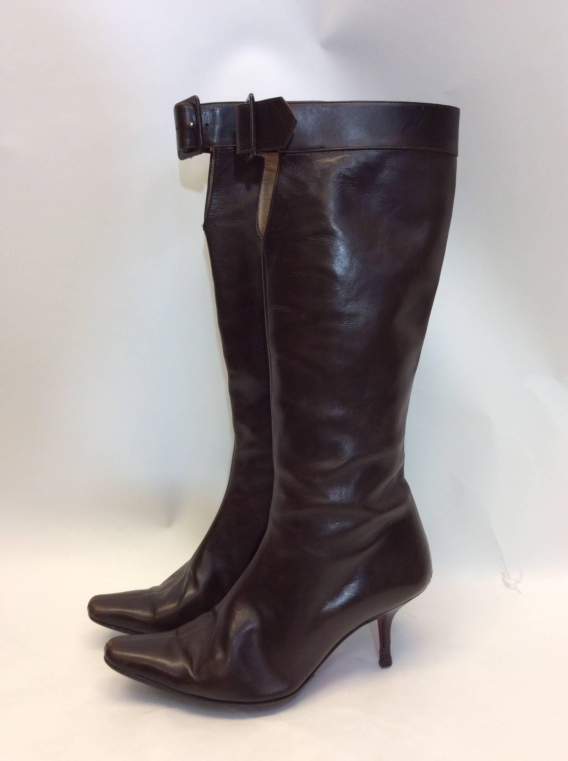 Christian Louboutin Brown Leather Buckle Boots
$250
Size 36.5
2.5 inch heel size zipper and top front buckle 
Made in Italy
**signs of wear on heels, see photo