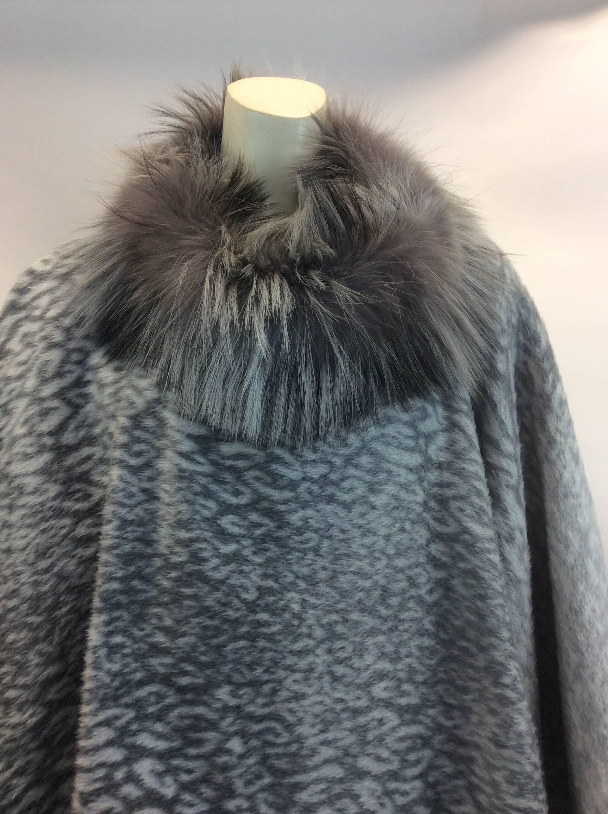 Mazzi Gray Leopard Fox Trimmed Cape
$399
Made in Italy 
41% acrylic, 21% polyester, 18% viscose 16% wool, 4% nylon
Neck portion is Fox
