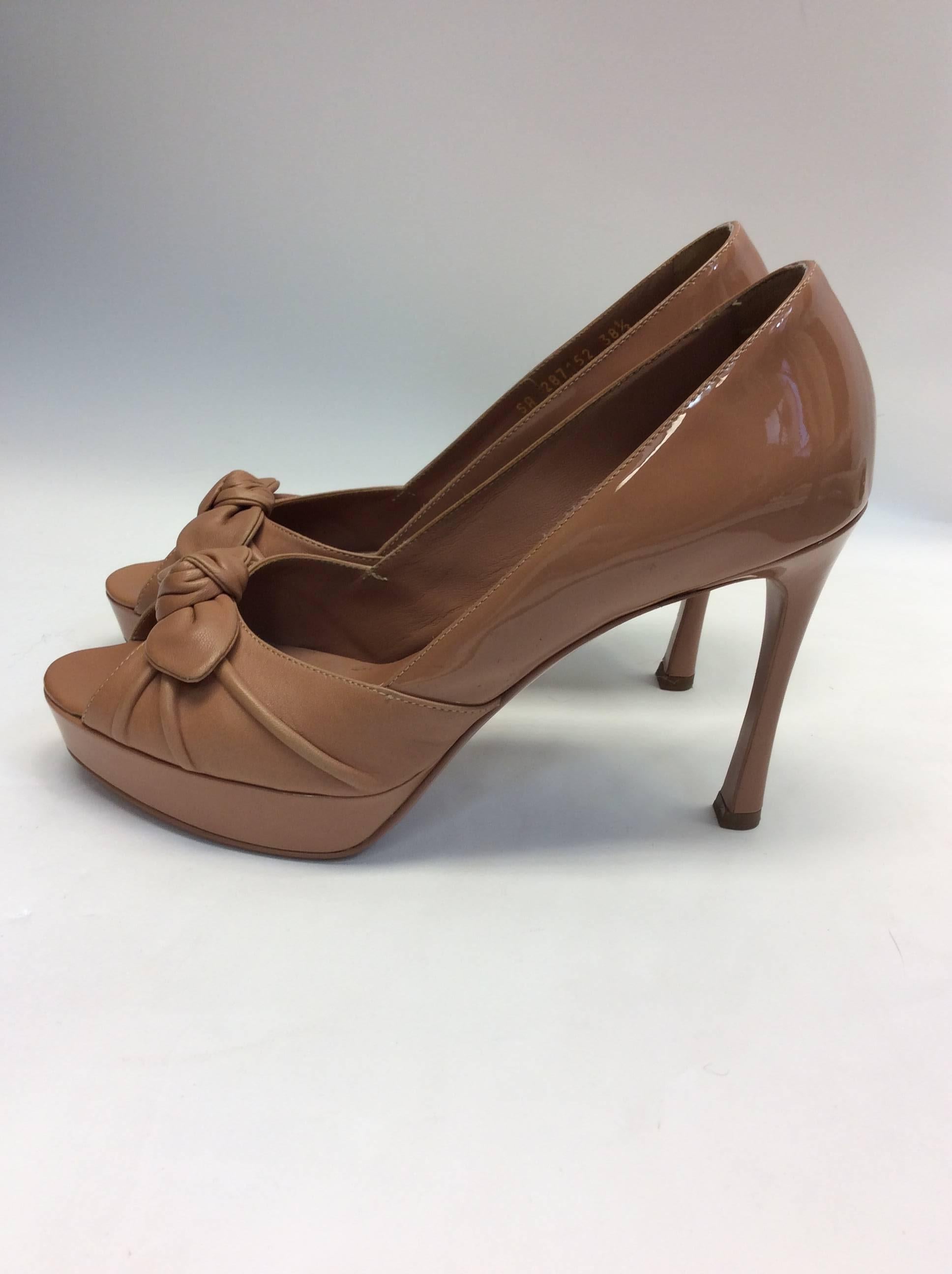 Yves Saint Laurent Nude Patent Peep Toe Heels
$299
Size 38.5 
Made in Italy
4.25 inch heel