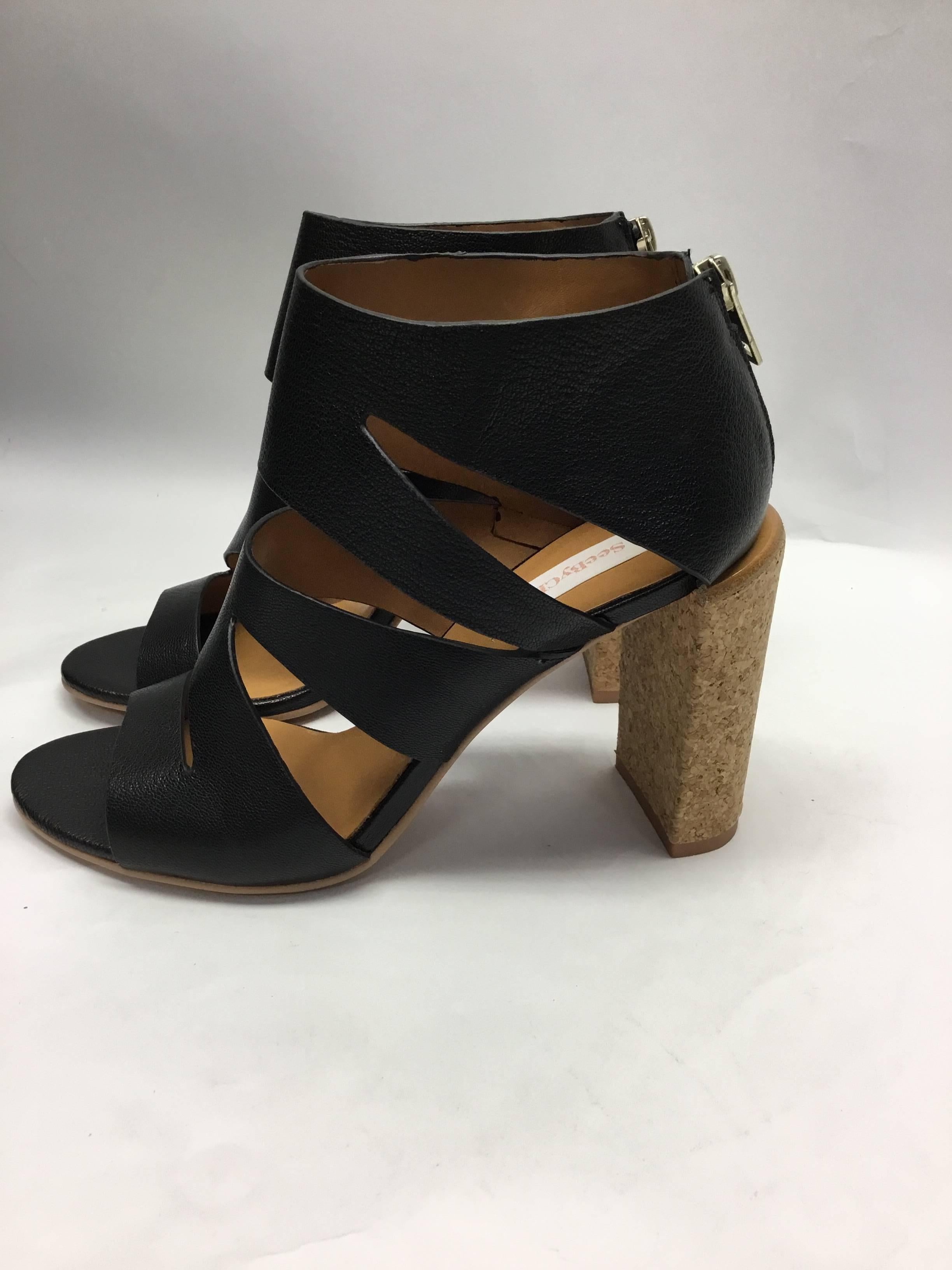 See By Chloe Black Leather Cut Out Heels
4 inch heel
Black leather cut out style
Cork heel, zip up back
Size 38.5
$250