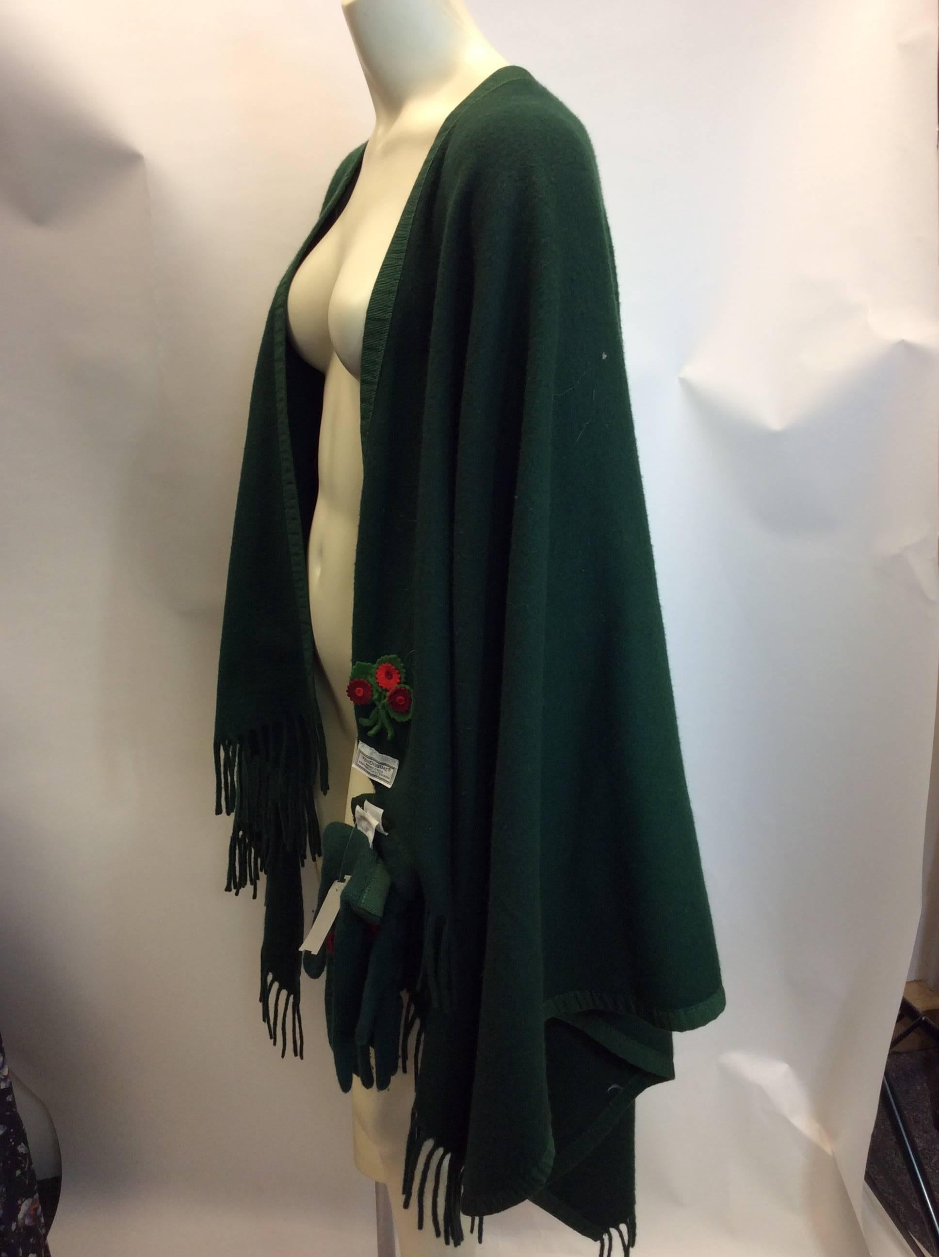 Fendi Evergreen Wool Fringe Cape With Gloves
Made in Italy
Rosette applique on gloves and cape
Fringe trim
Lambswool 
$400
34 inches short in the front, 44 inches at the longest point in the back