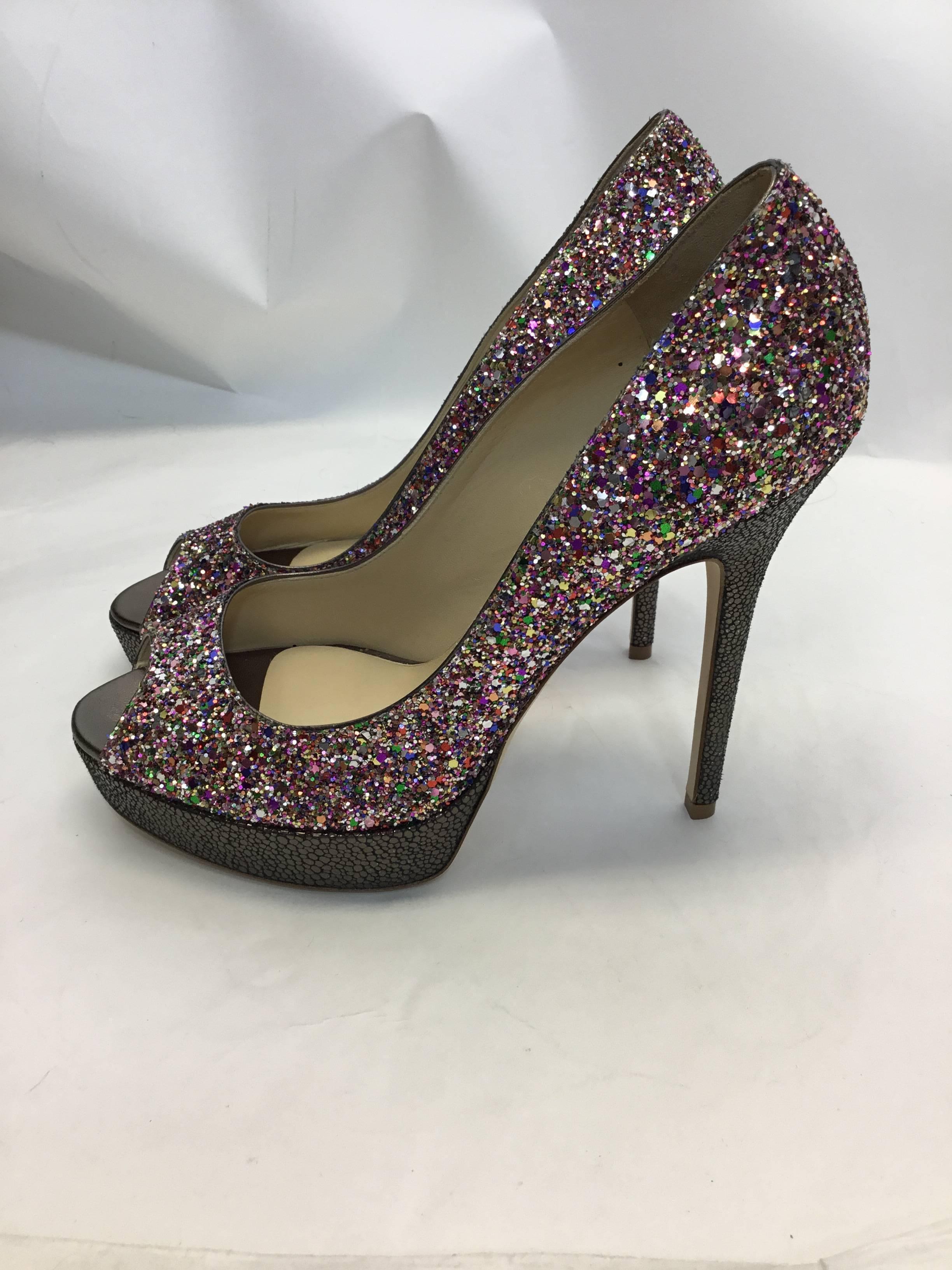 Jimmy Choo New Glitter & Snake Printed Stilletos
$599
Size 38.5
5 inch heel, one inch platform
Made in Italy