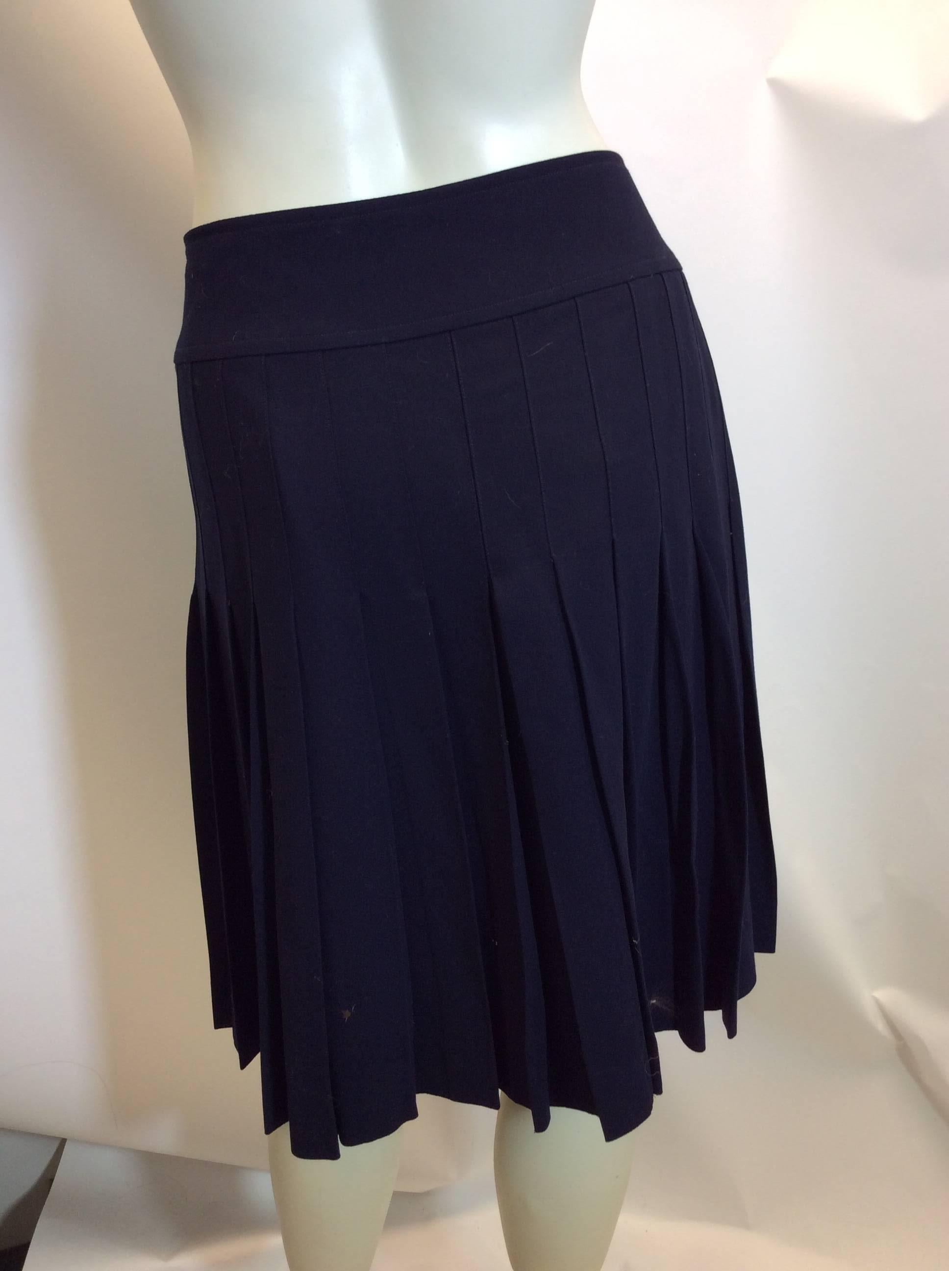 Chanel Navy Pleated Wool Skirt
$250
Beautiful Chanel buttons

