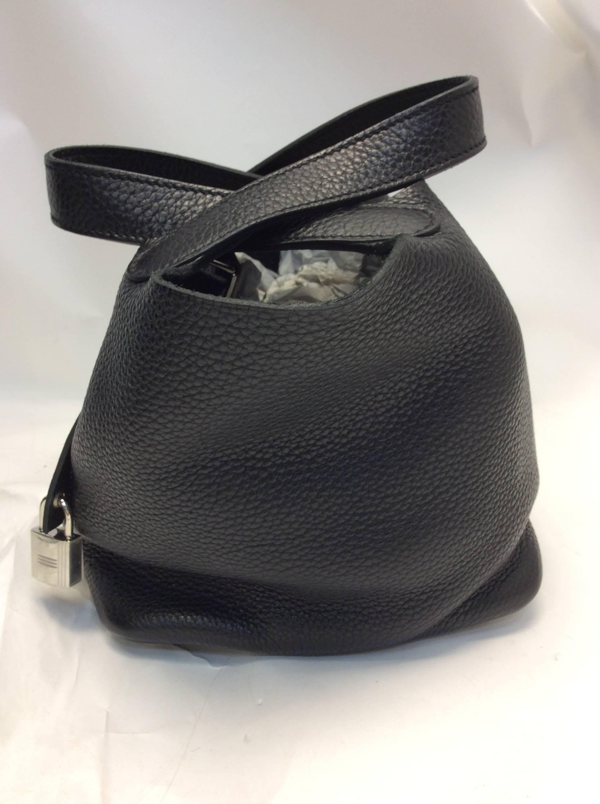 Hermes Picotin Black Leather Small Bag
Silver toned hardware 
$2100
Dog feet on the bottom
Lock and key included

