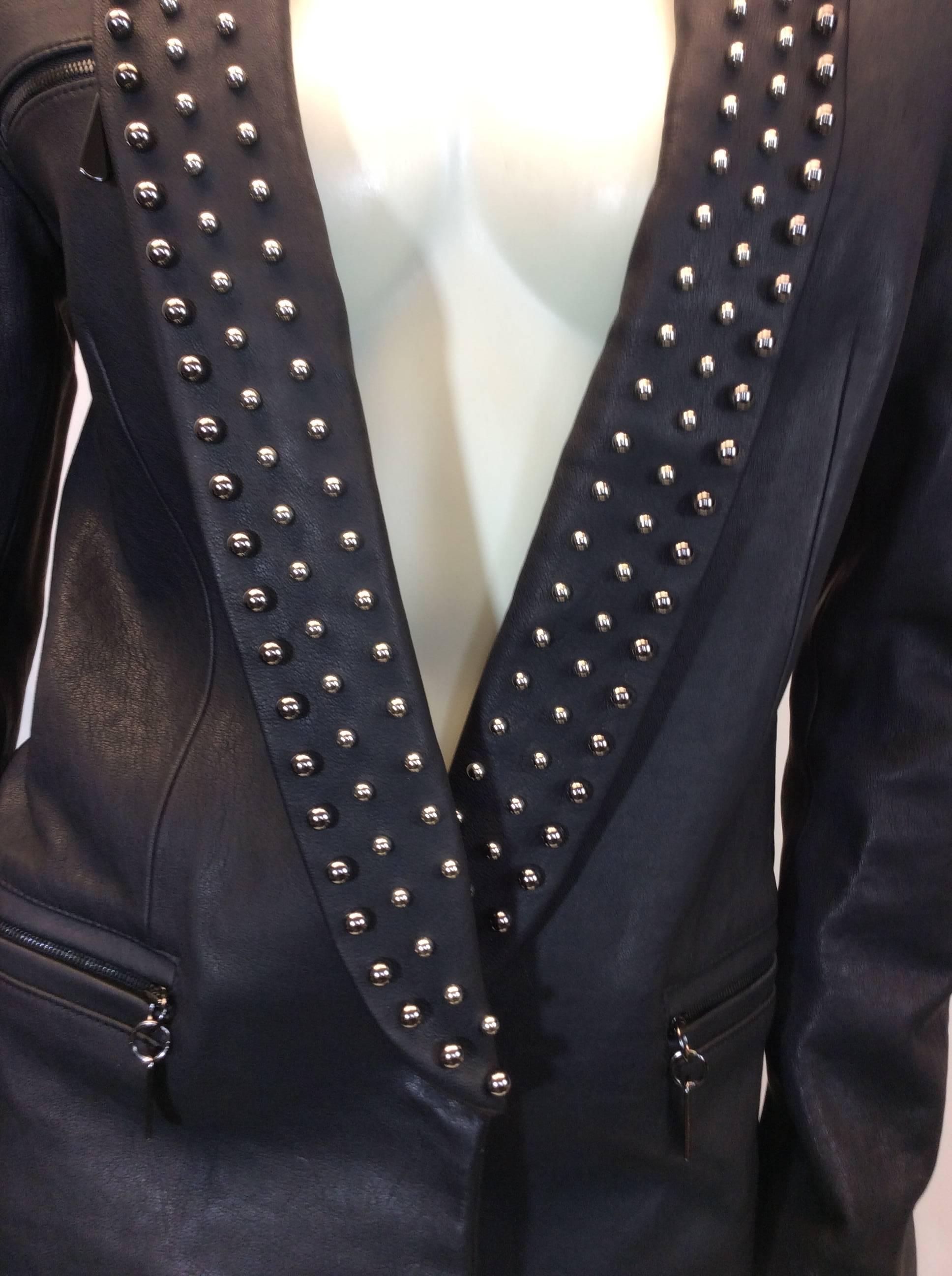 Thomas Wylde Leather Studded Black Blazer
Made in Korea
$599
Fully lined interior, 91% silk, 9% spandex
Middle snap button closure
Size small
100% lamb skin exterior with silver toned studded embellishments