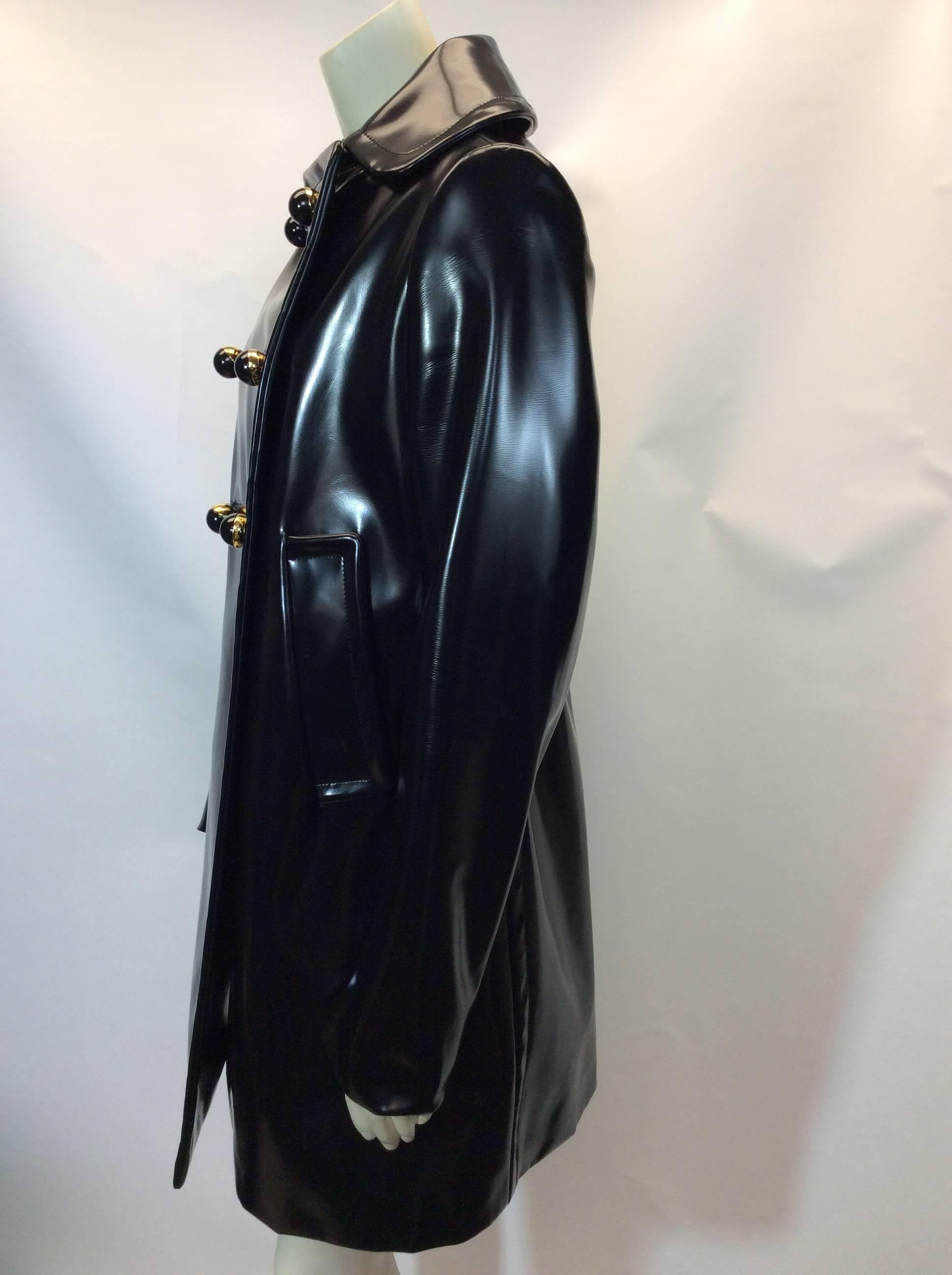 Prada Black Patent Rain Coat W/ Removable Wool Collar
$799
Optional tan wool collar
Size 40
Fully lined interior

