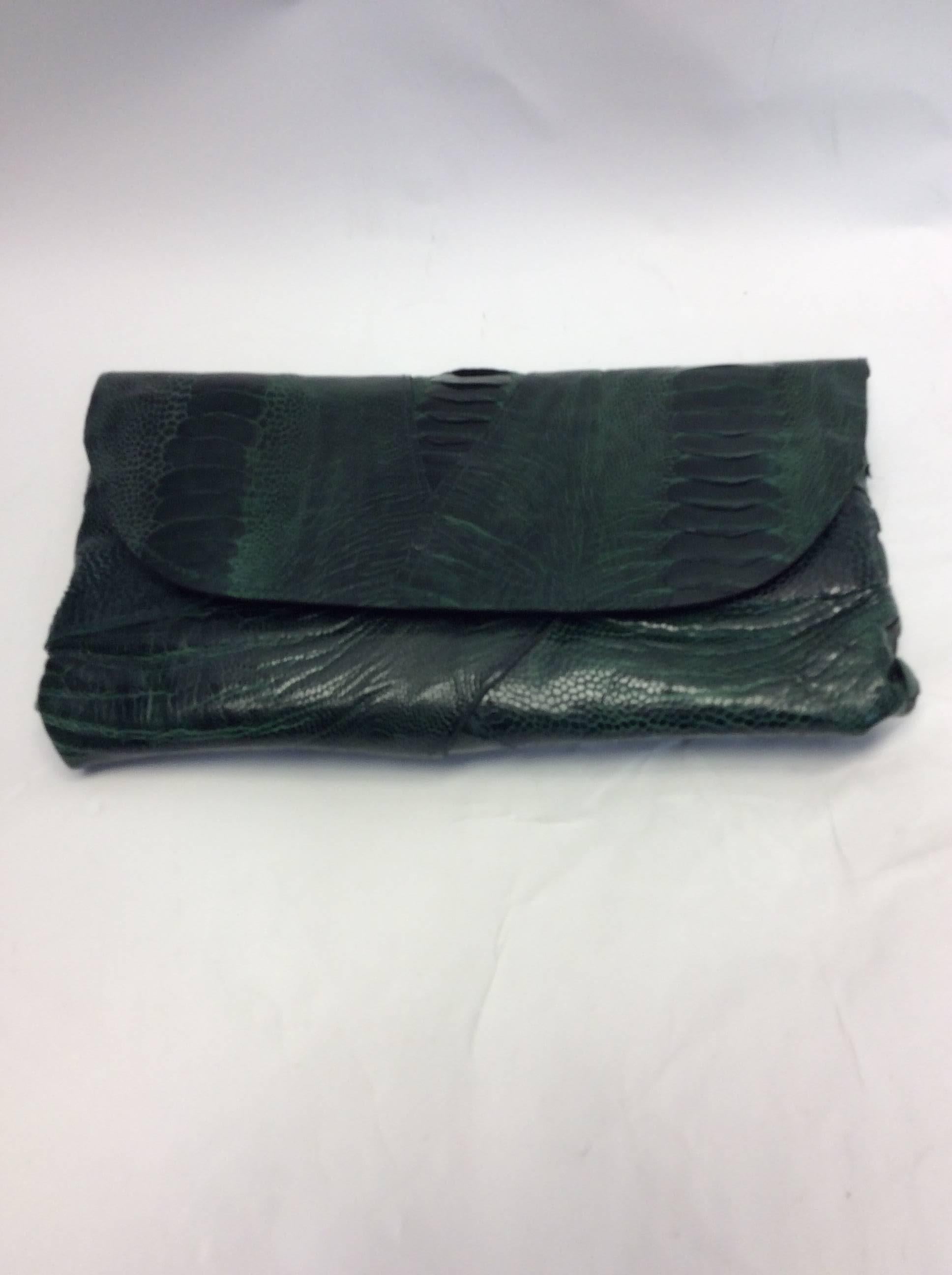 Deb Barnett Green Crocodile Skin Clutch
Fold over clutch 
$399
10X6X2